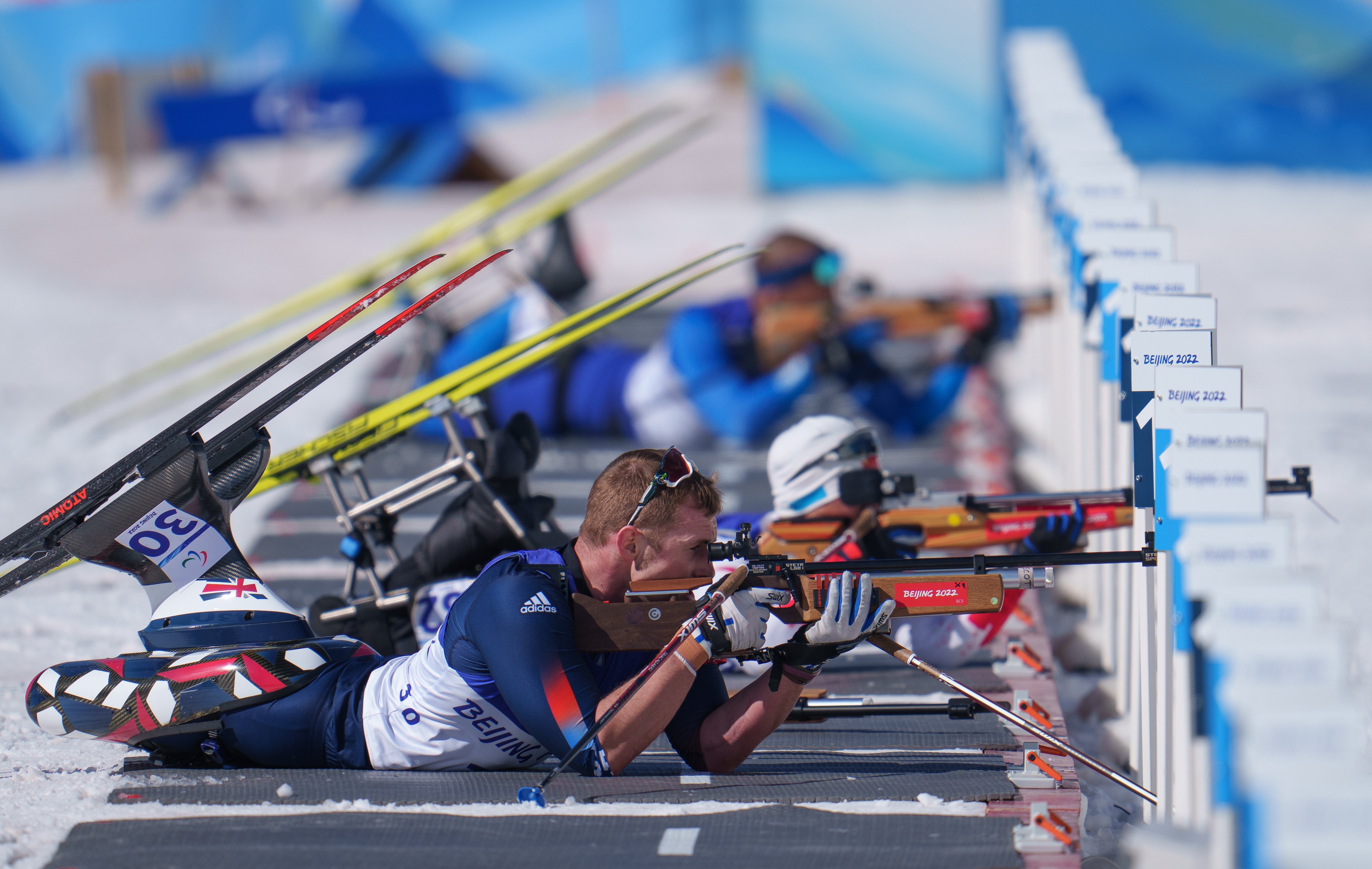 Scott Meenagh on the shooting range in the middle distance sitting para biathlon at the Zhangjiakou National Biathlon Centre