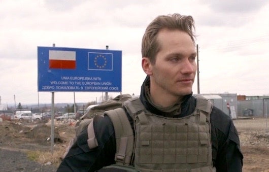 Kristofer Kalas dressed in full body armour at the Ukrainian border