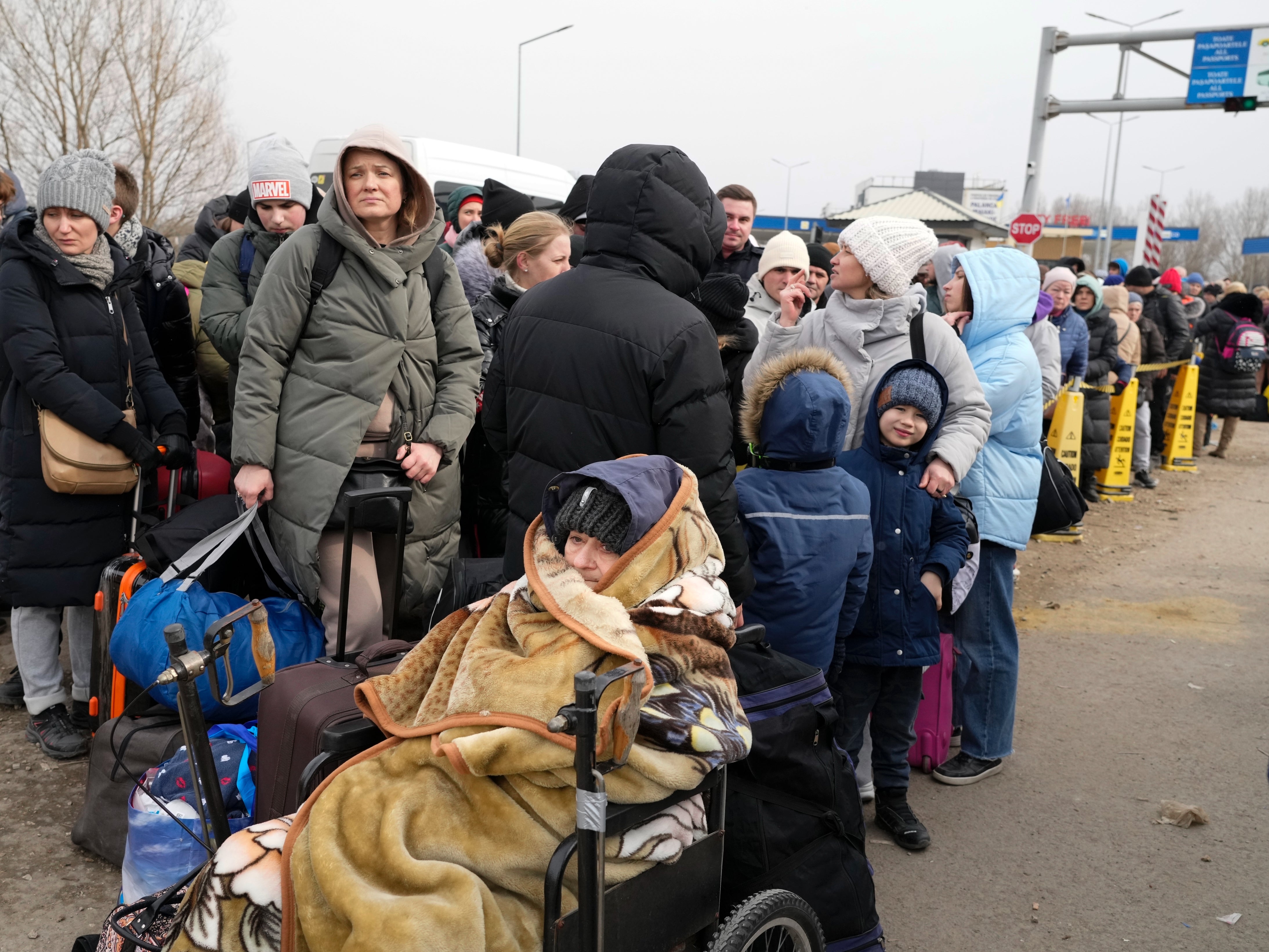 Refugees arrive at the border crossing in Palanca, Moldova