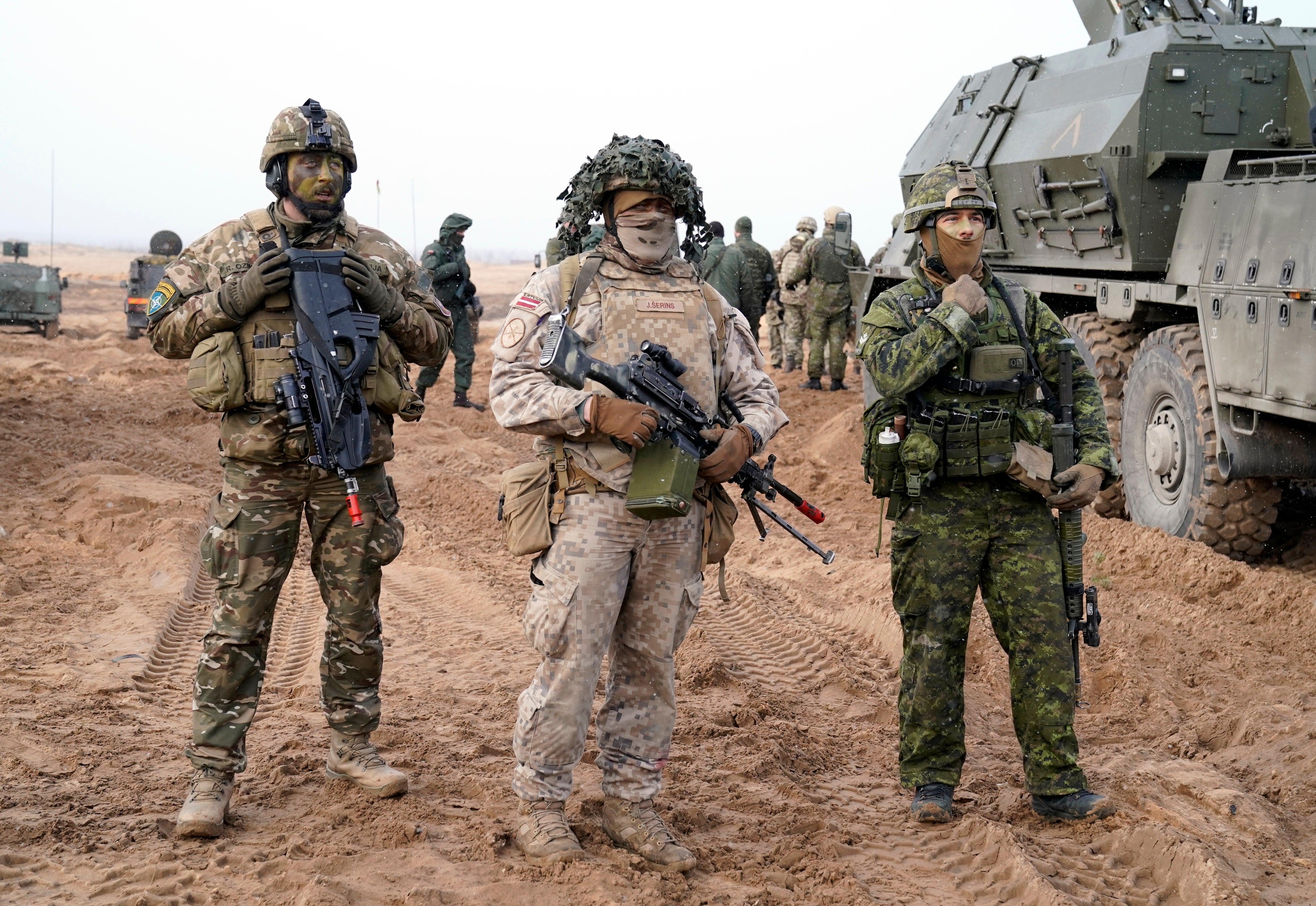 Nato troops pose for a photo prior to military exercises in Adazi Military base in Kadaga, Latvia on 8 March