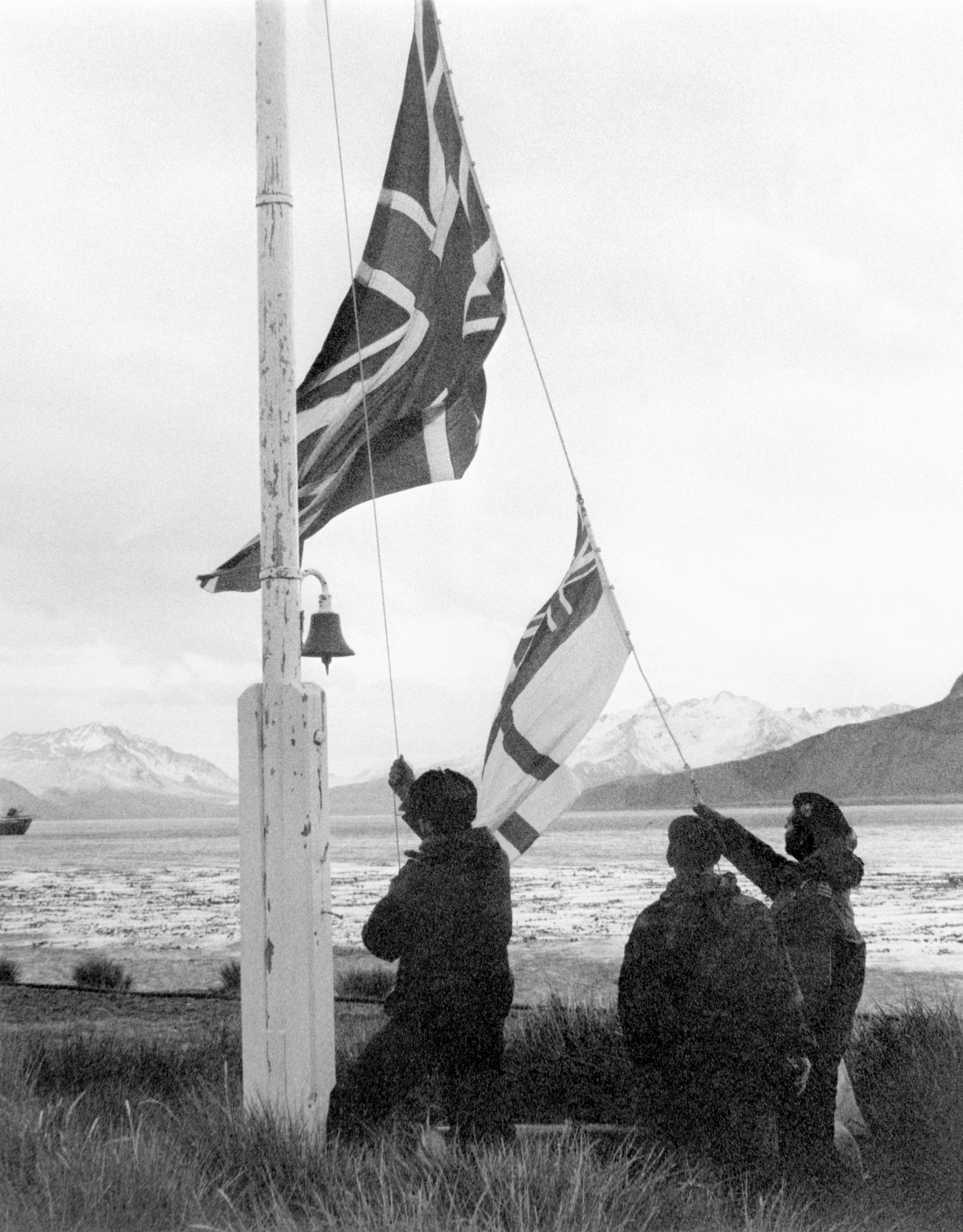 The union jack being raised on South Georgia after the island's recapture by the British