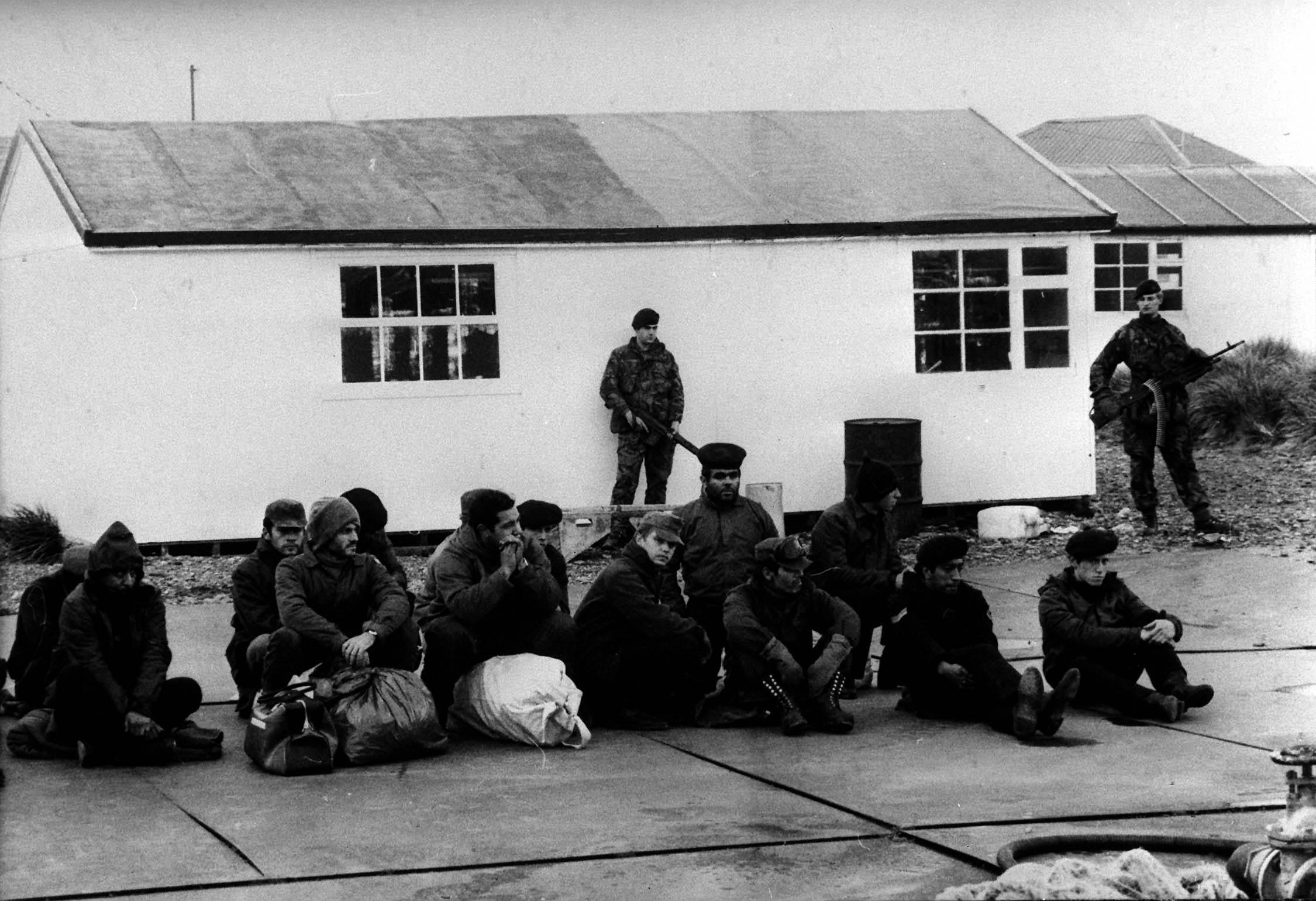 Argentinian prisoners under guard by the royal marines after the recapture of South Georgia