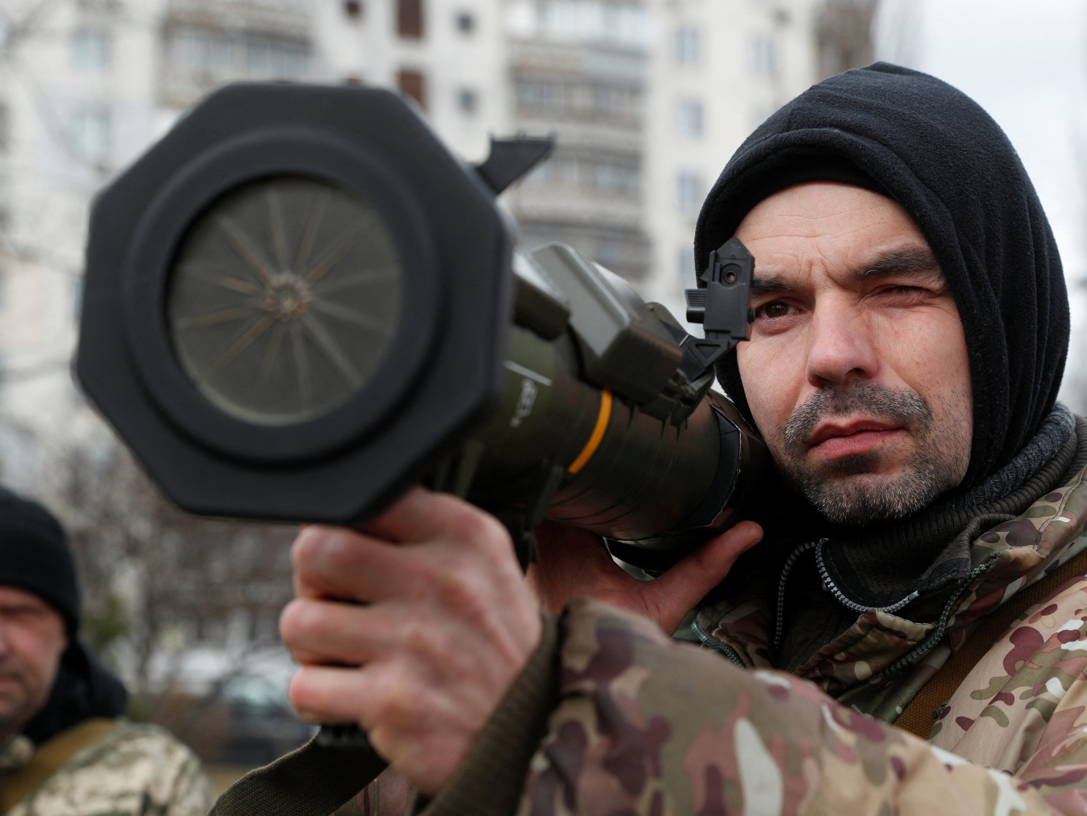 A new member of the Territorial Defence Forces trains to operate AT4 anti-tank launcher