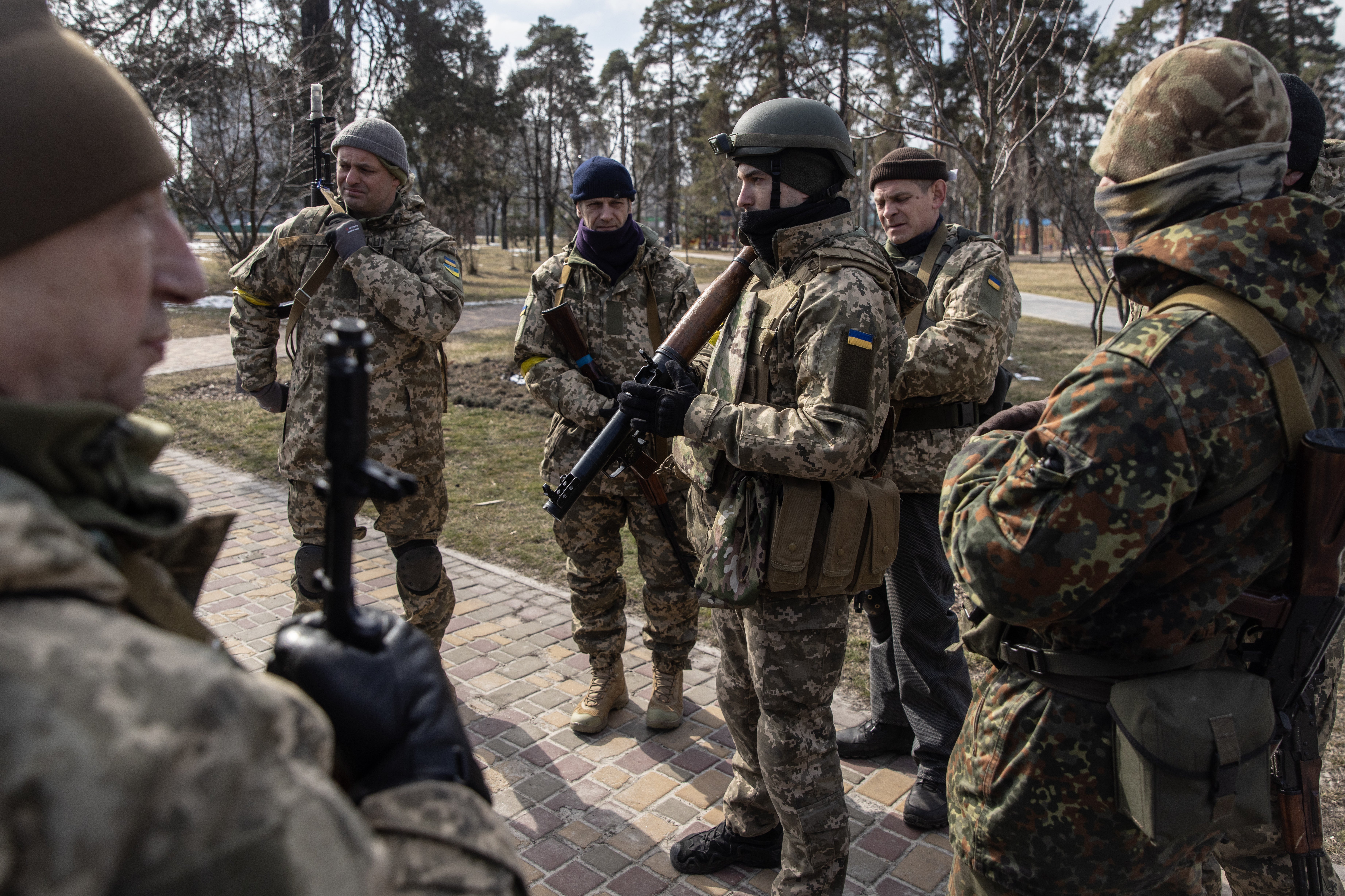 Members of the Territorial Defence Forces learn how to use weapons in Kyiv, Ukraine