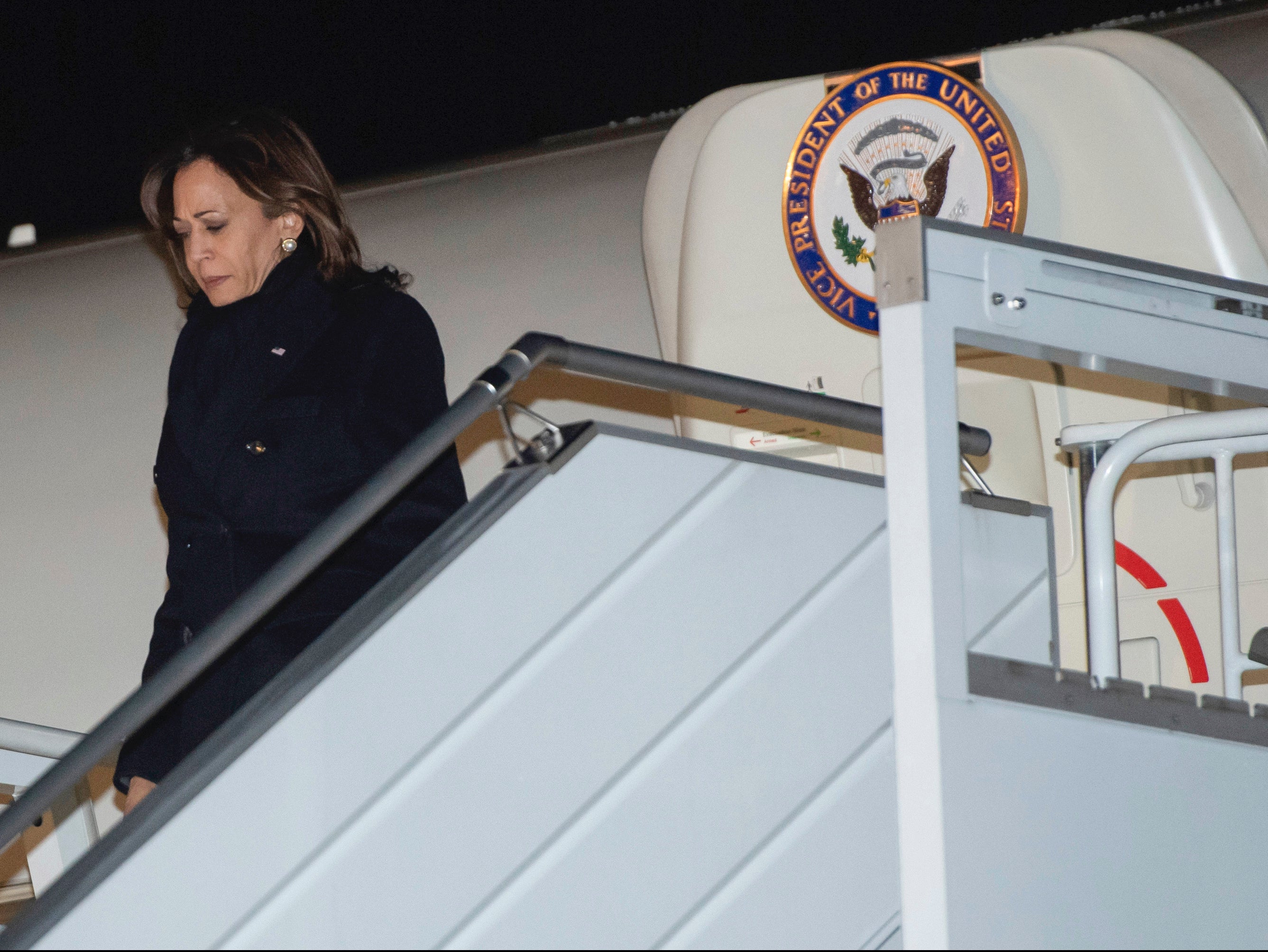 U.S. Vice President Kamala Harris disembarks from Air Force Two upon arrival at Warsaw Chopin Airport in Warsaw, Poland, Wednesday, March 9, 2022, as she travels on a 3-day trip to Poland and Romania for meetings about the war in Ukraine. (Saul Loeb/Pool via AP)