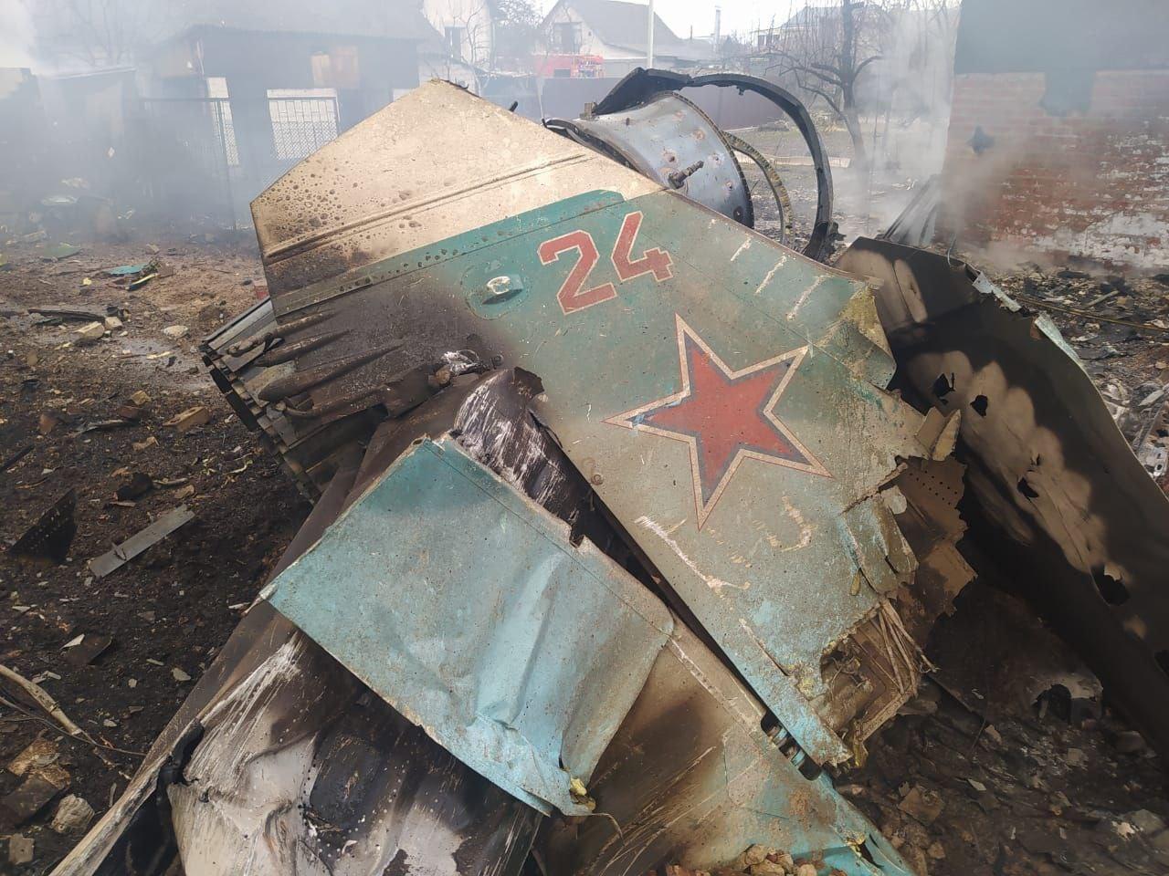 Debris of a military plane is seen after it was shot by Ukrainian forces on 5 March