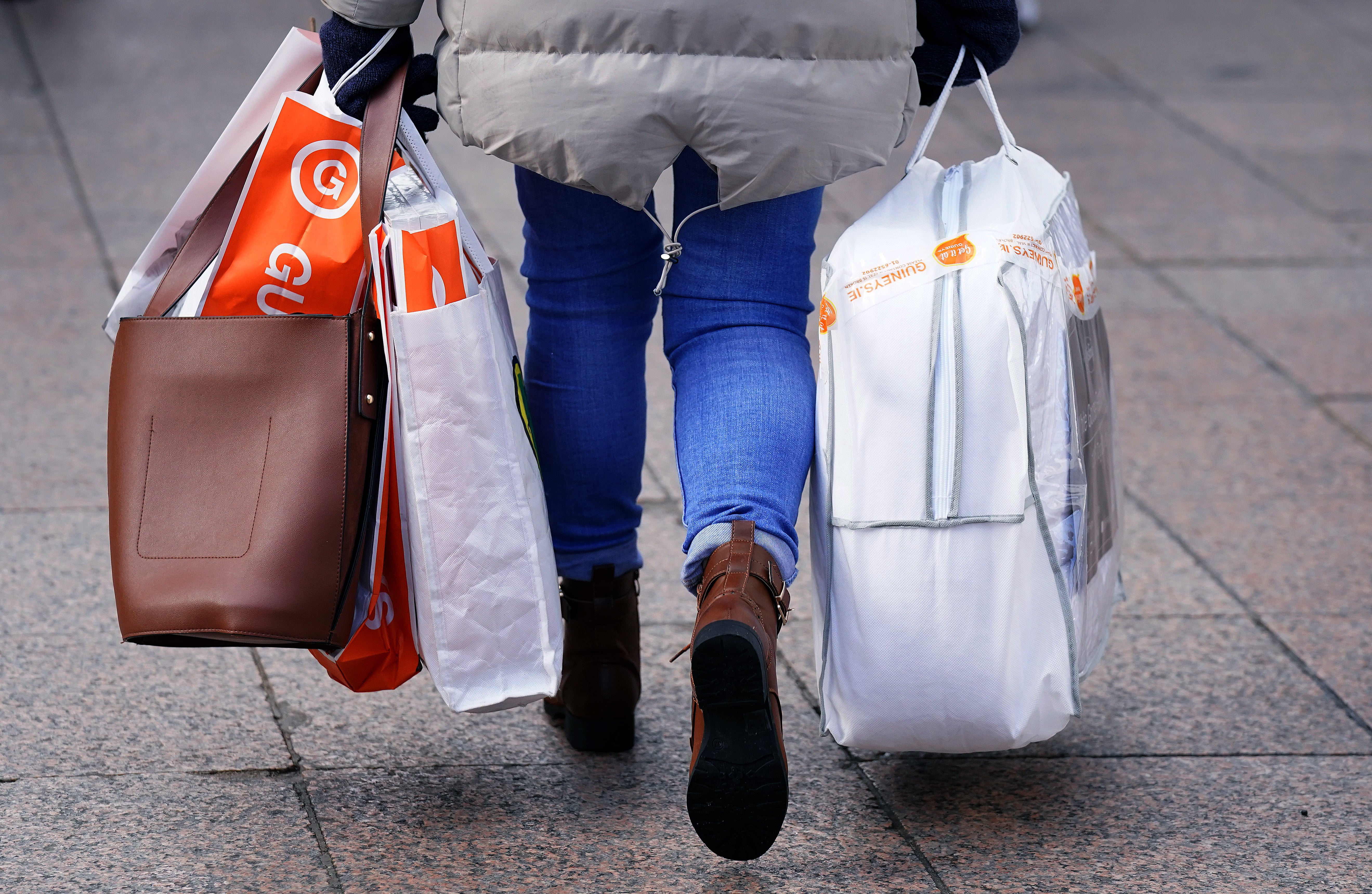 A woman carrying several shopping bags on Henry Street in Dublin’s city centre. Inflation has reached its highest level in 21 years (Brian Lawless/PA)