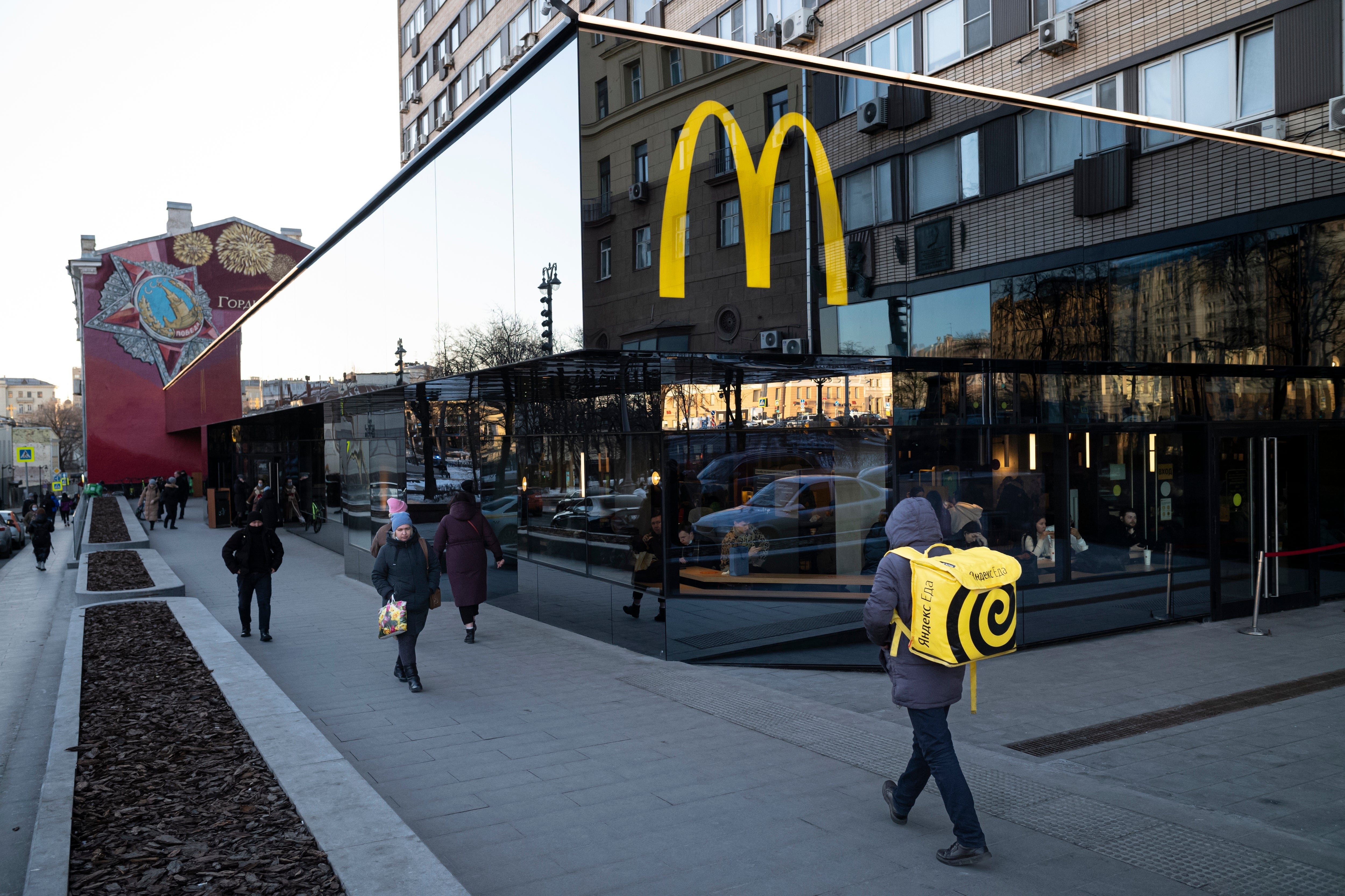 People walk past a McDonald’s restaurant in Moscow