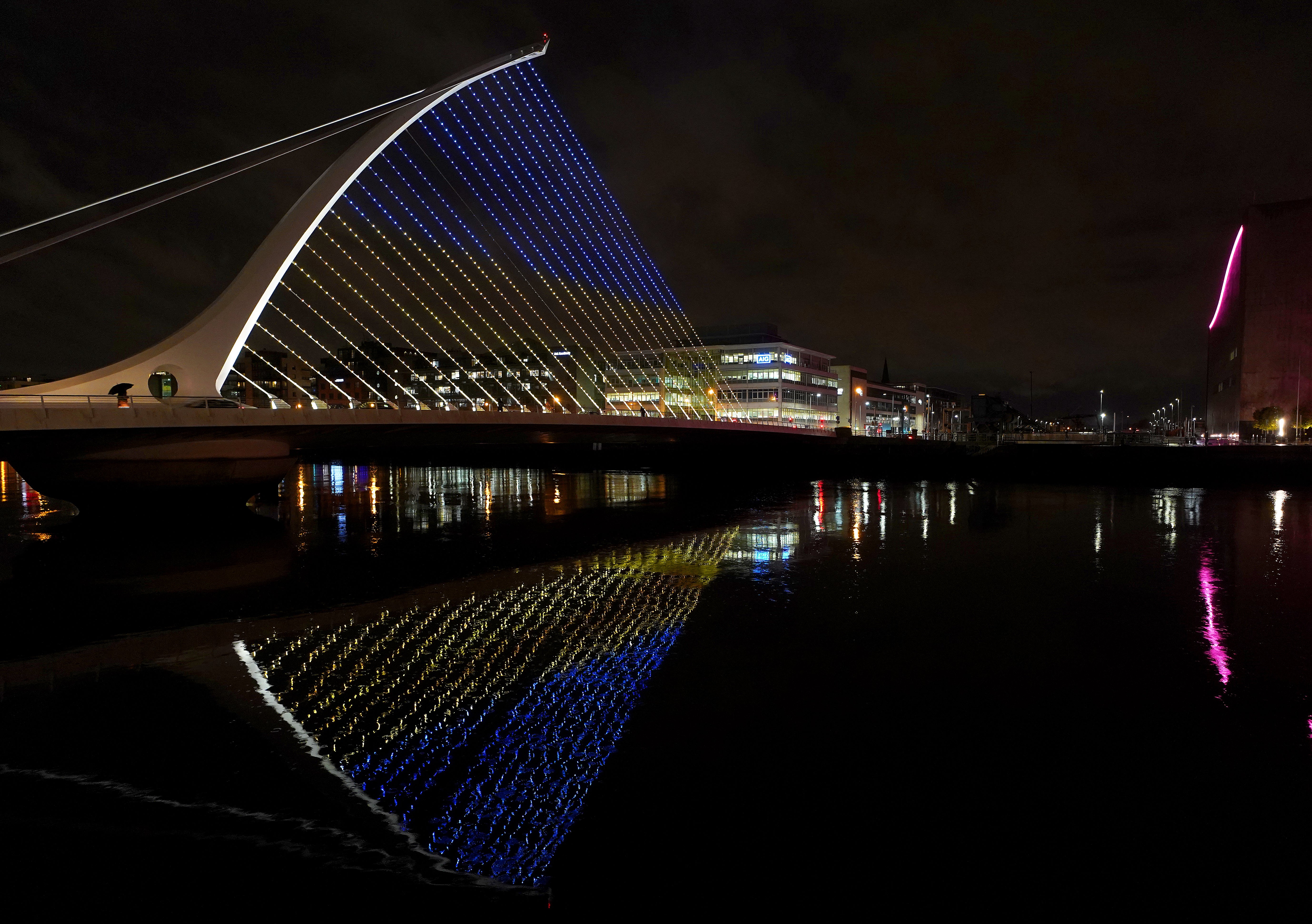 The Samuel Beckett Bridge in Dublin’s city centre displays the colours of the Ukrainian flag as a show of support. Simon Coveney appeared before the Oireachtas Foreign Affairs Committee on Thursday (Brian Lawless/PA)