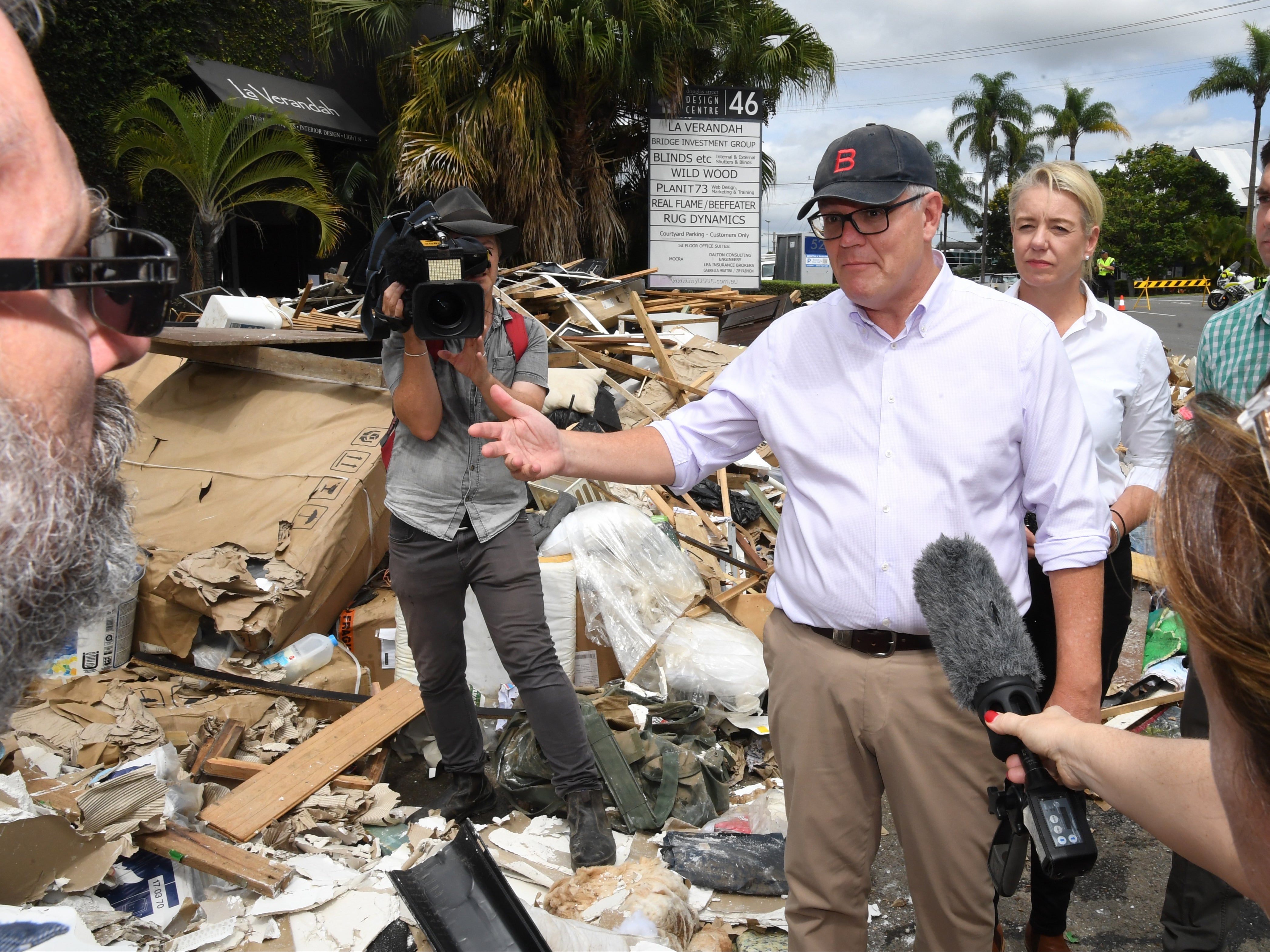 Australian prime minister Scott Morrison inspecting flood damage in the suburb of Brisbane, Queensland, on 10 March