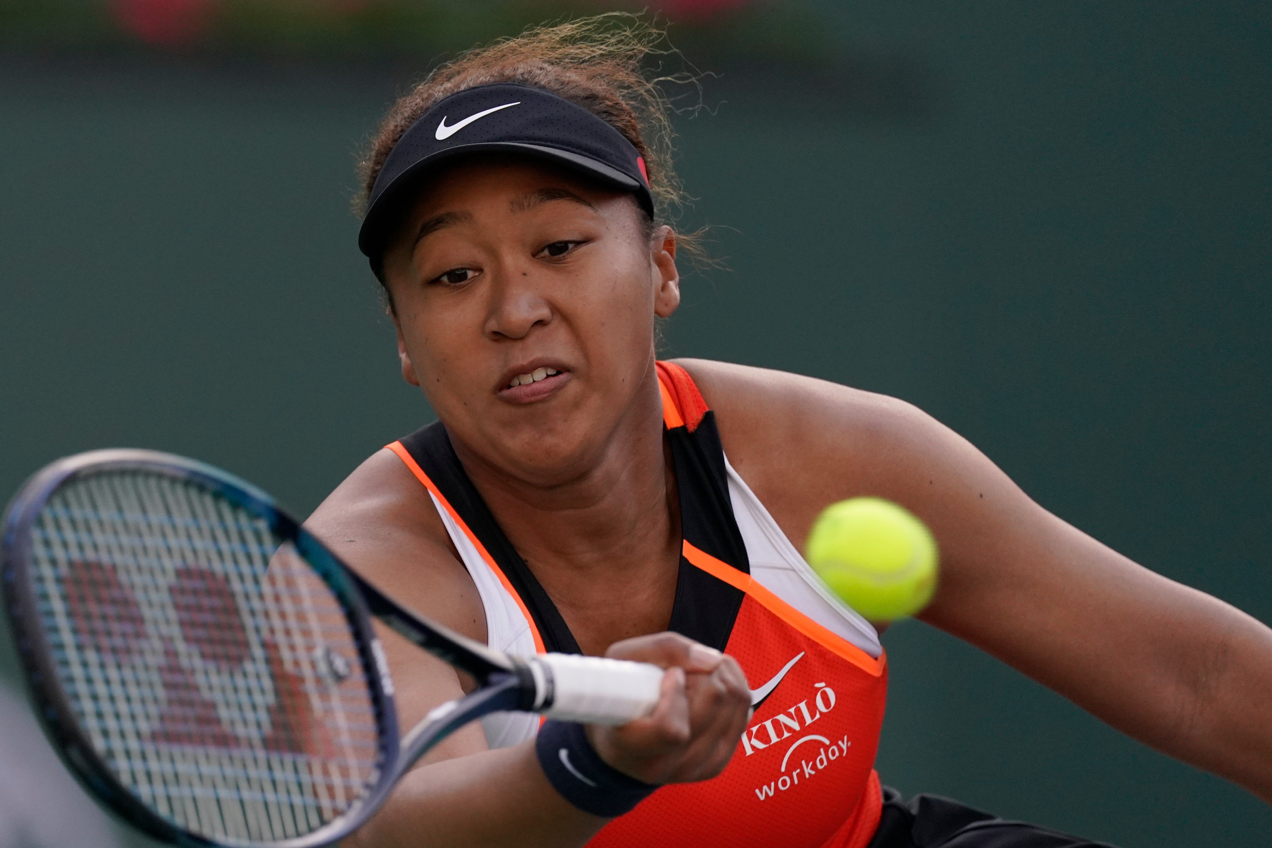 Naomi Osaka, of Japan, returns a shot to Sloane Stephens at the BNP Paribas Open tennis tournament (Mark J. Terrill/AP)