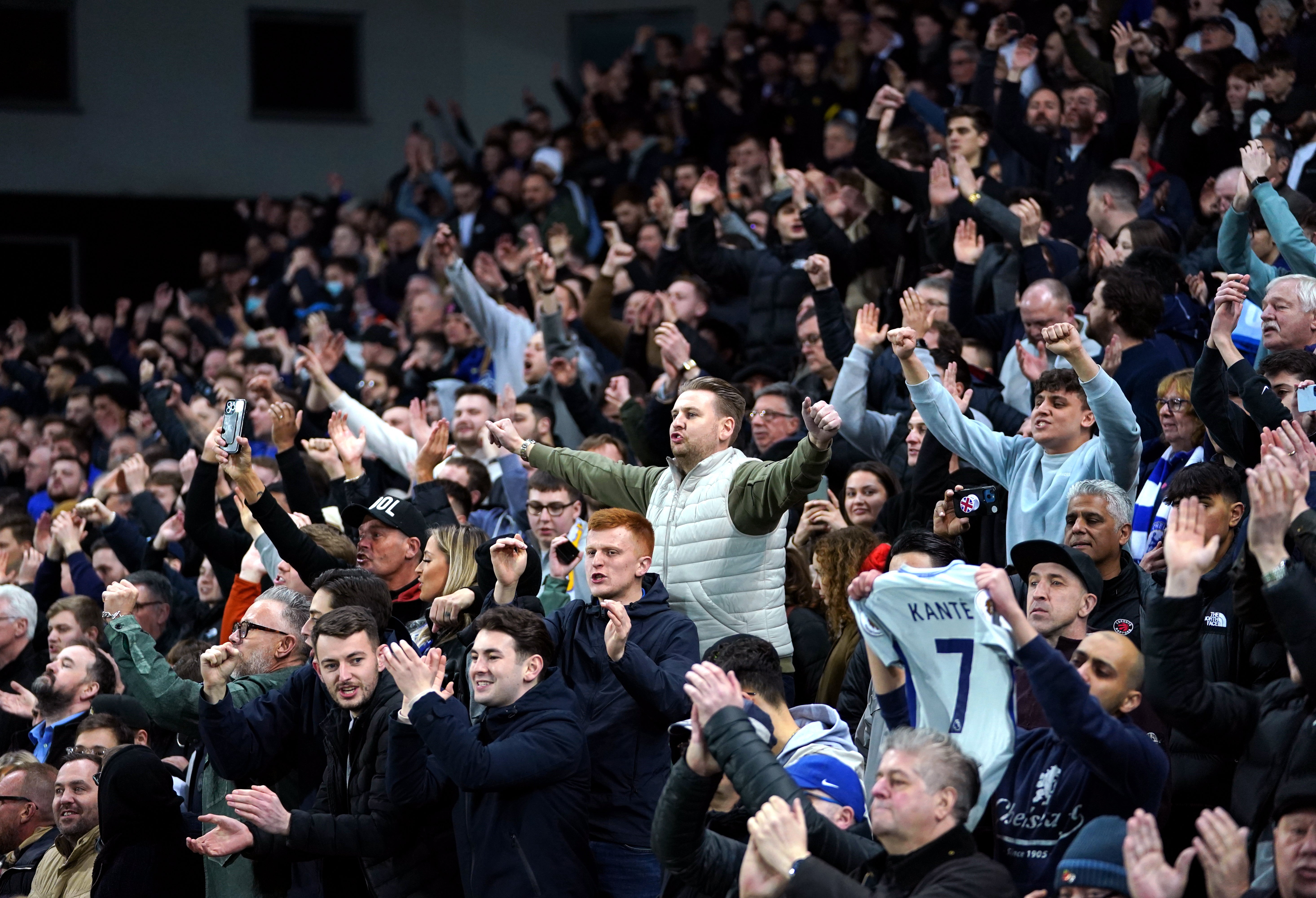 Chelsea fans celebrate the team’s victory at Norwich on Thursday night (Joe Giddens/PA)