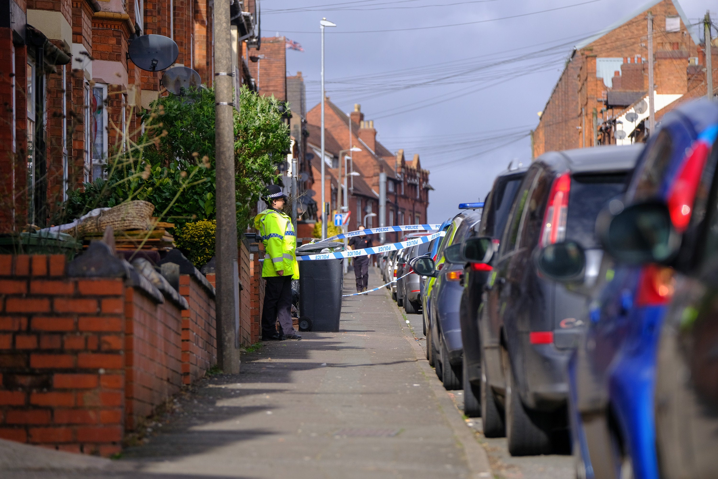 Police on a nearby road which was closed after the stabbing