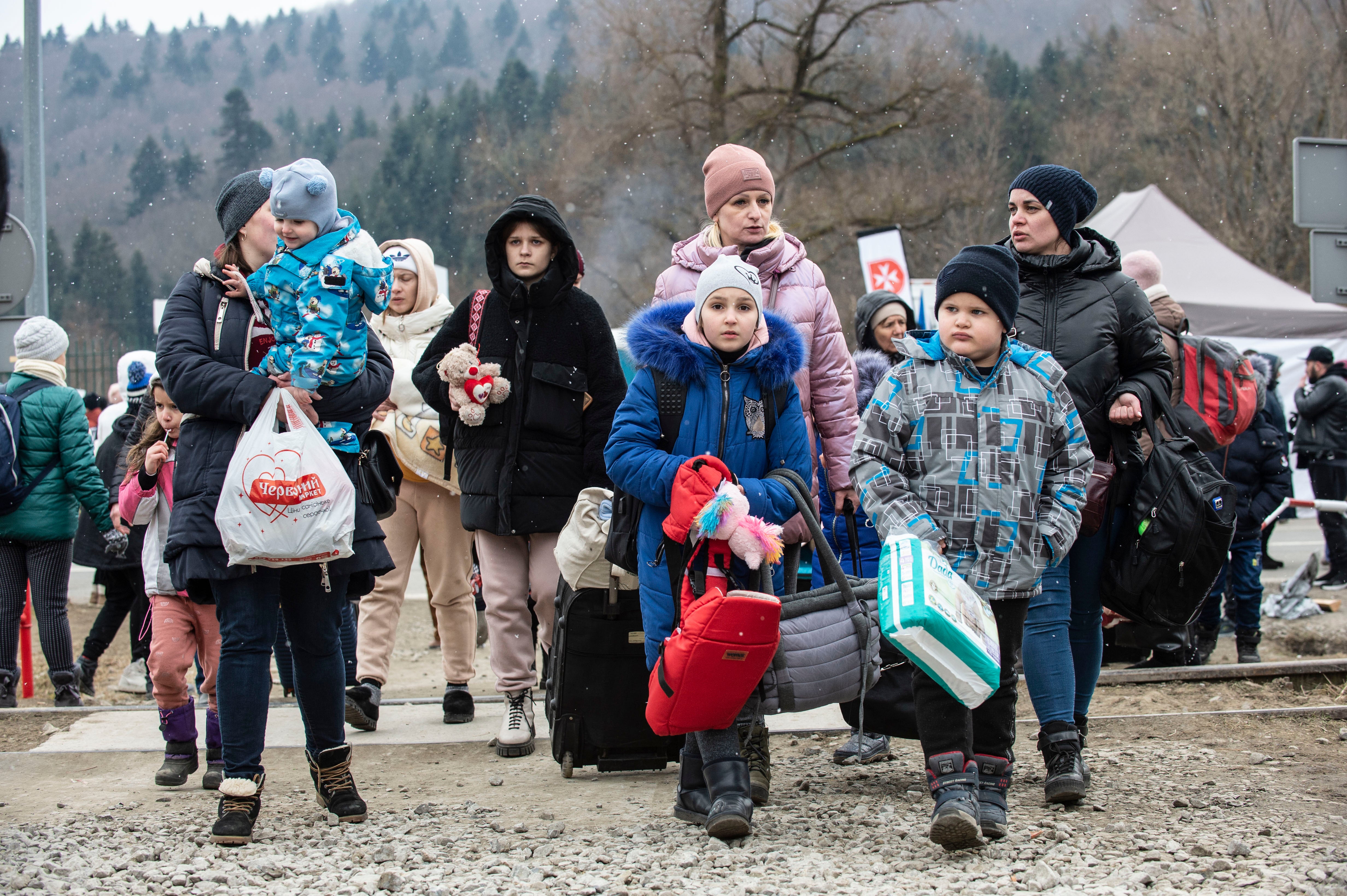 Thousands of mothers have crossed the border into Poland with their young children