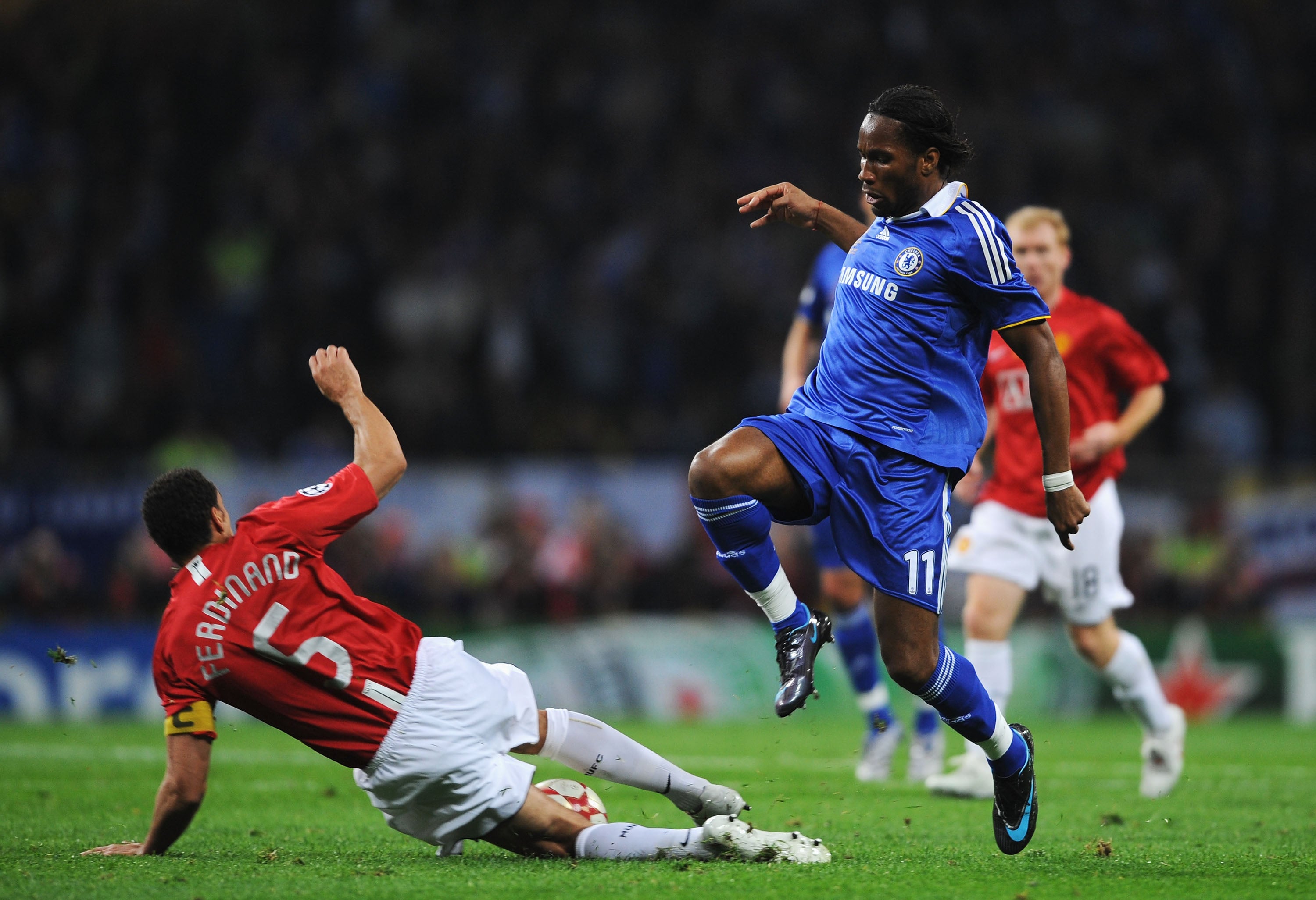 Ferdinand wins the ball from Didier Drogba in Moscow