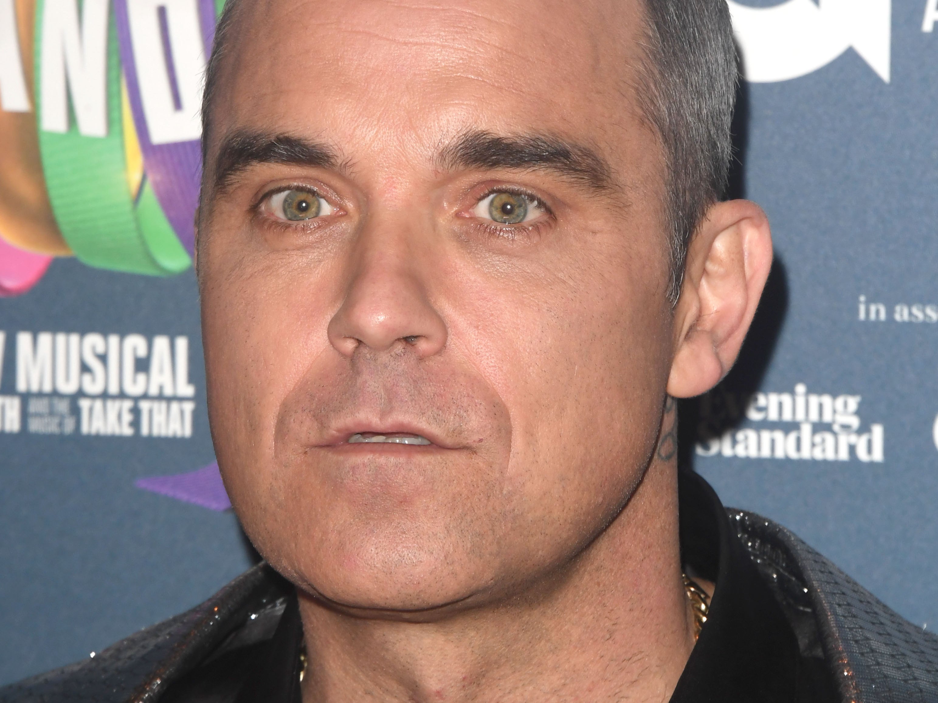 Robbie Williams addressed rumours he sold his property to Drake