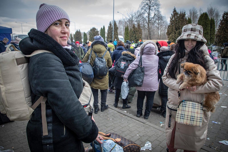 Anastasia Vasina, right, with her mother at a reception centre in Hala Kijowska. It took them three days to reach Poland from their home town, Nikopol