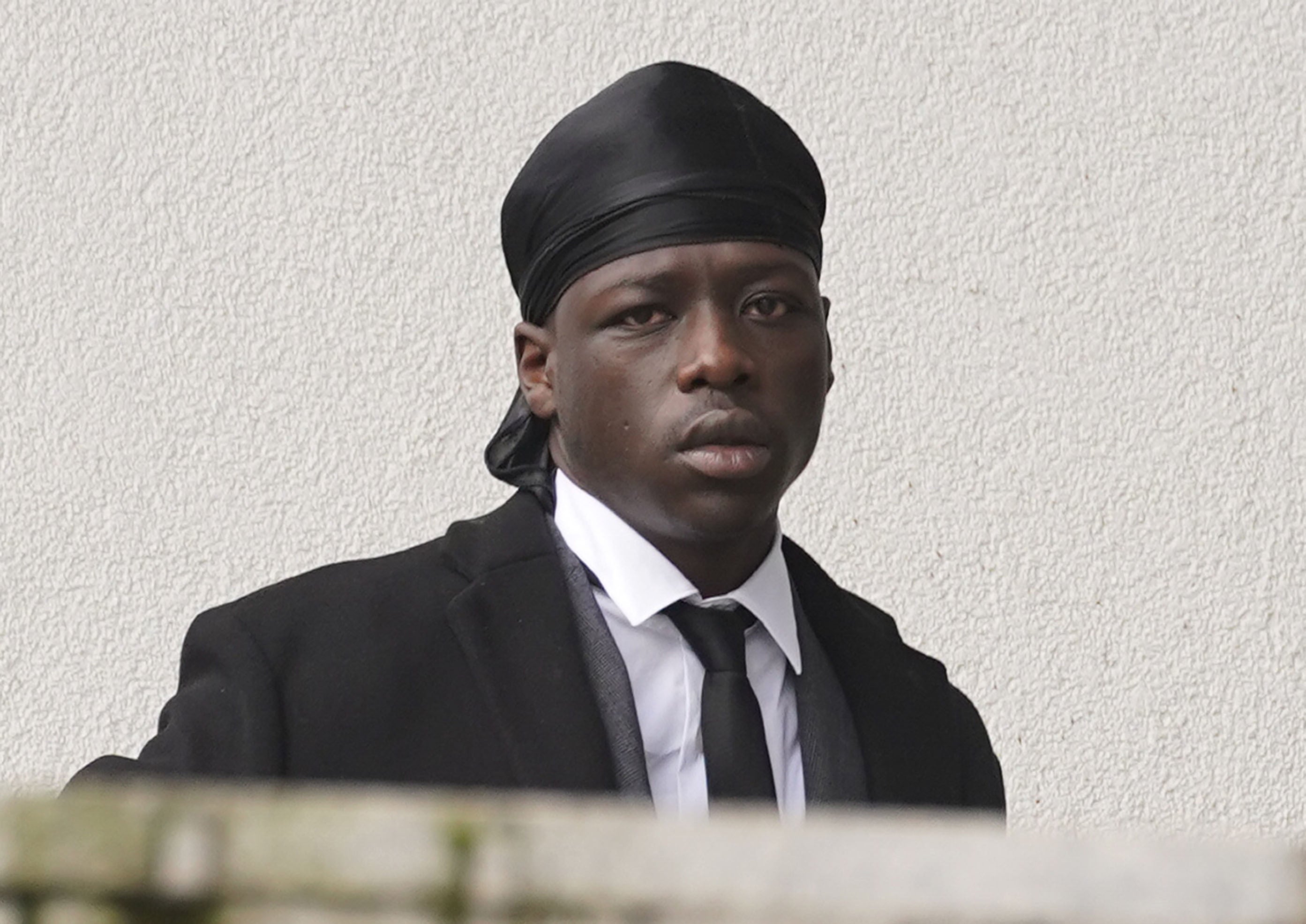 Rapper Pa Salieu arrives at Warwick Crown Court after he was charged following disorder near a city centre nightclub in September 2018. Salieu, whose full name is Pa Salieu Gaye, also faces a charge of possessing a bottle as an offensive weapon. Three other co-defendants are accused of violent disorder after a police inquiry into the death of Salieu’s friend, 21-year-old Fidel Glasgow. Salieu, aged 24, is on bail. Picture date: Tuesday March 1, 2022.