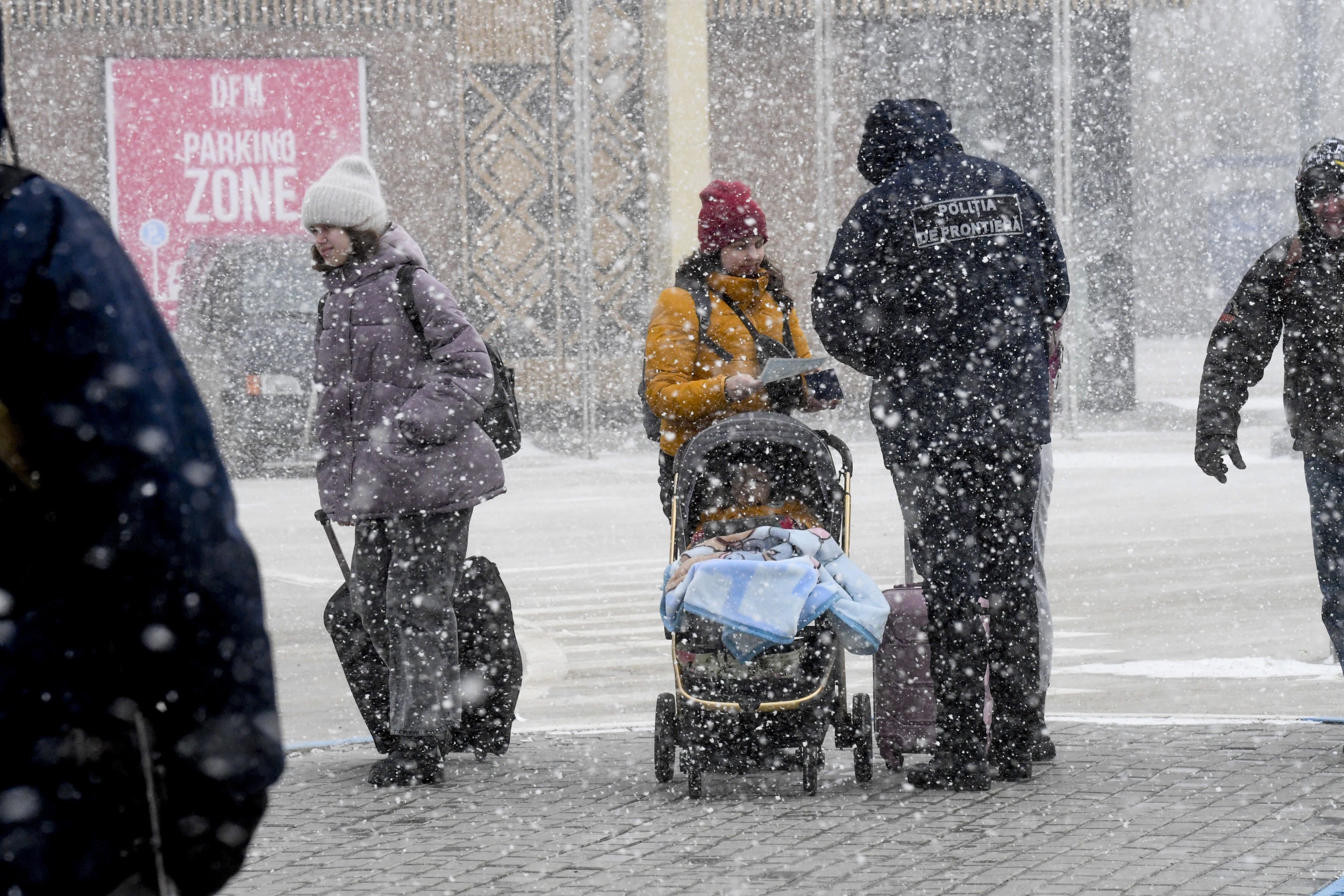 Ukrainians refugees flee war by crossing into Moldova on 11 March, 2022.