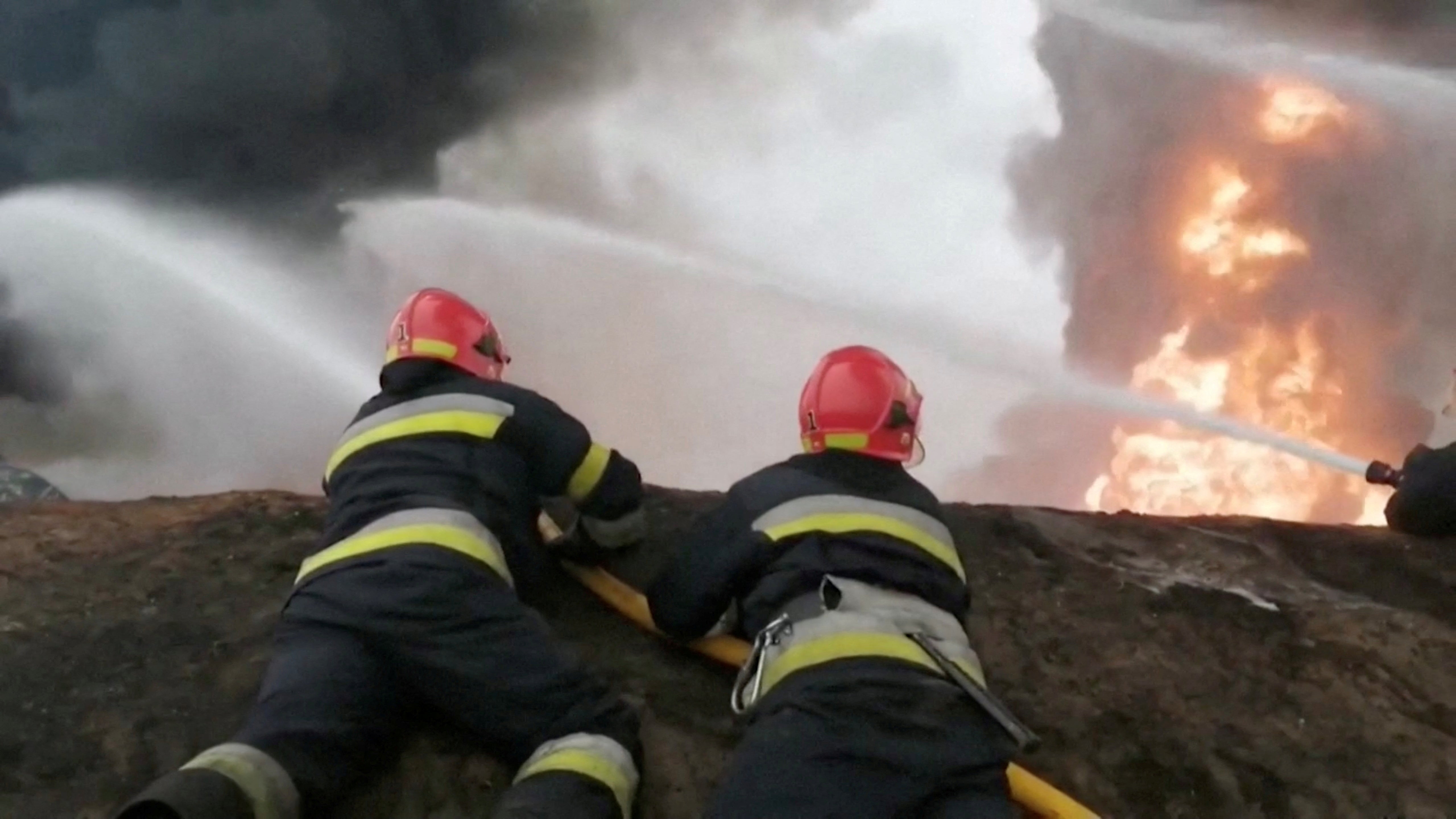 Firefighters work after a missile hit a build at Vinnytsia Airport