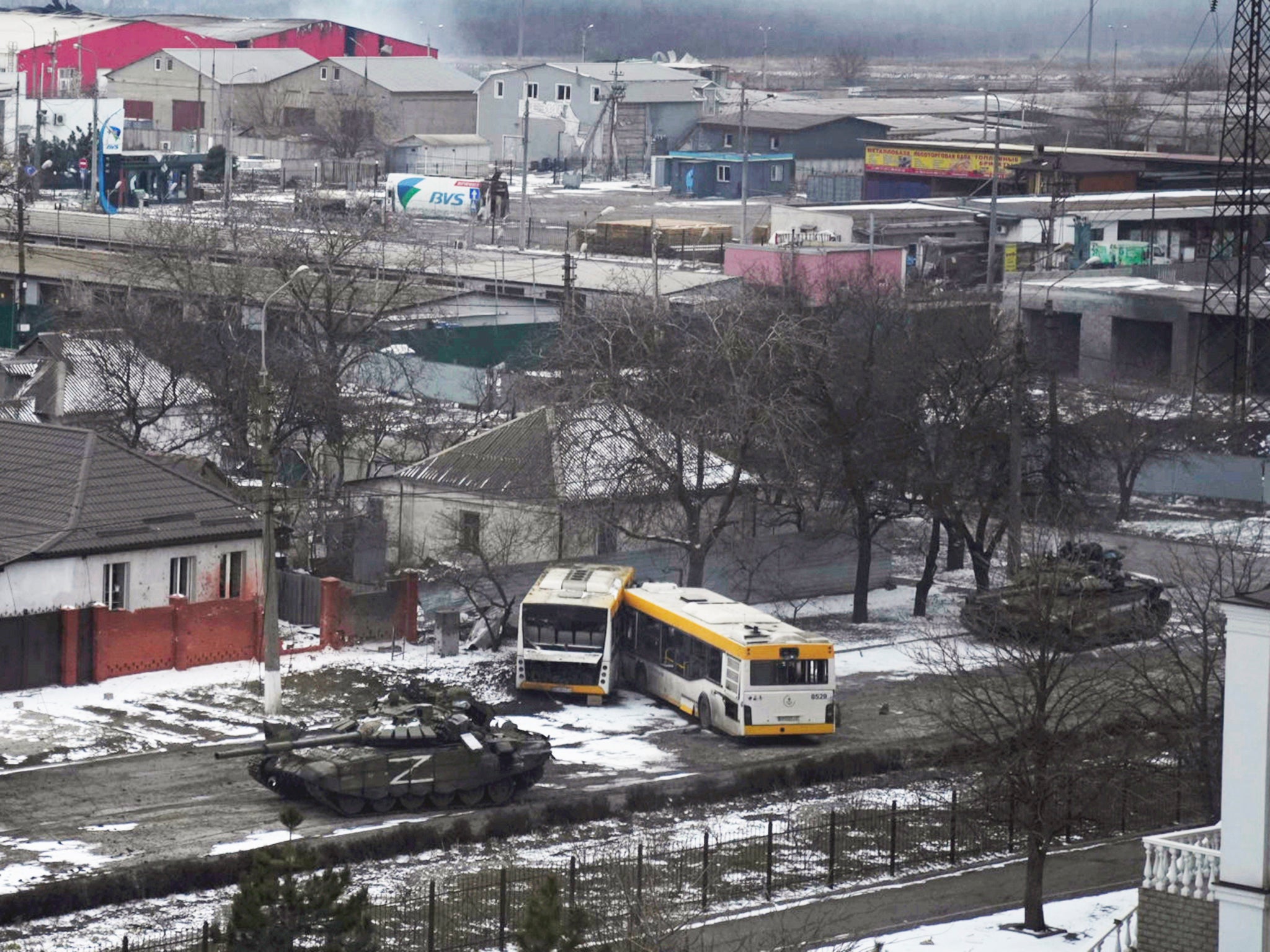 Russian tanks move on the outskirts of Mariupol on Friday