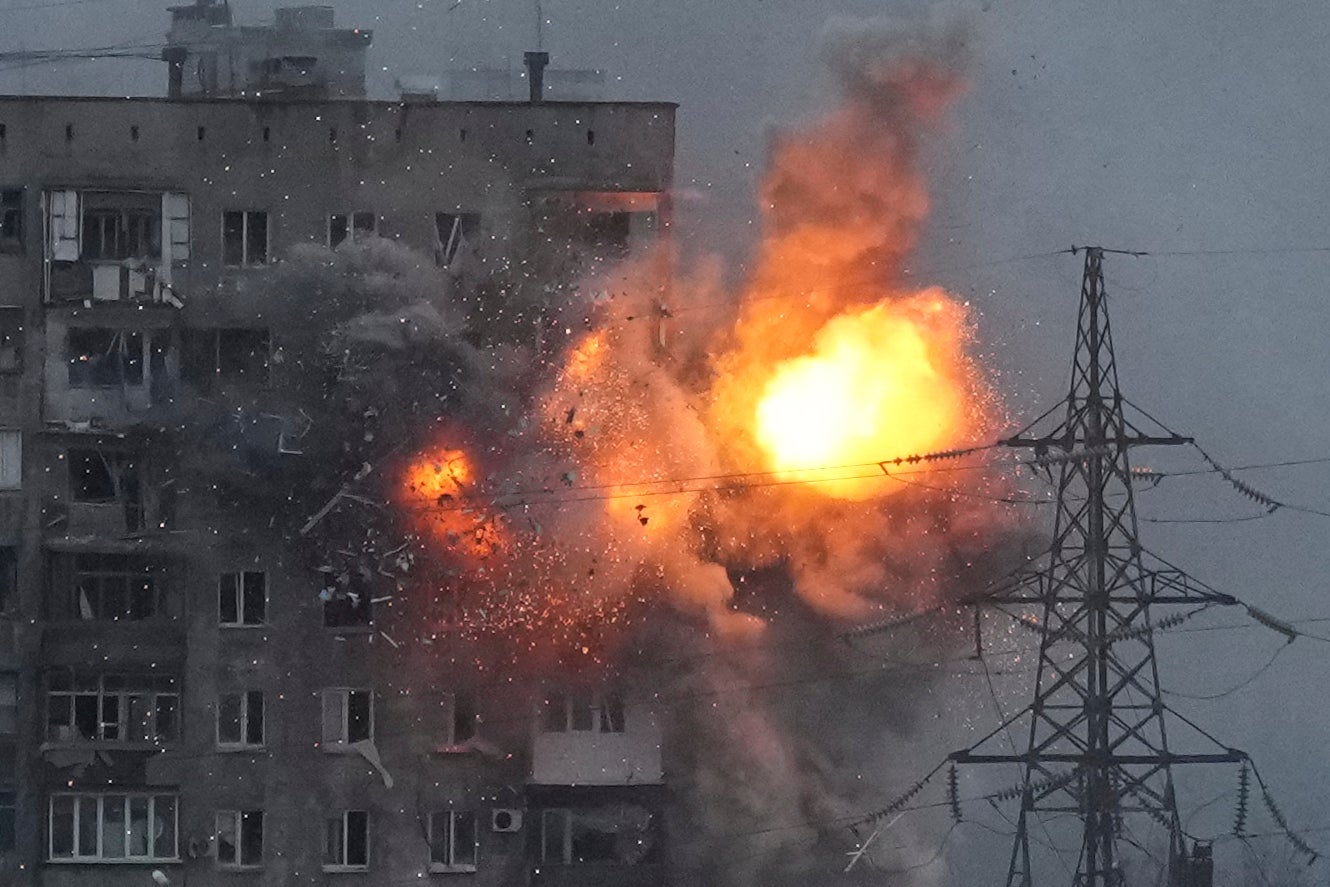 An explosion in an apartment building that came under fire from a Russian army tank in Mariupol