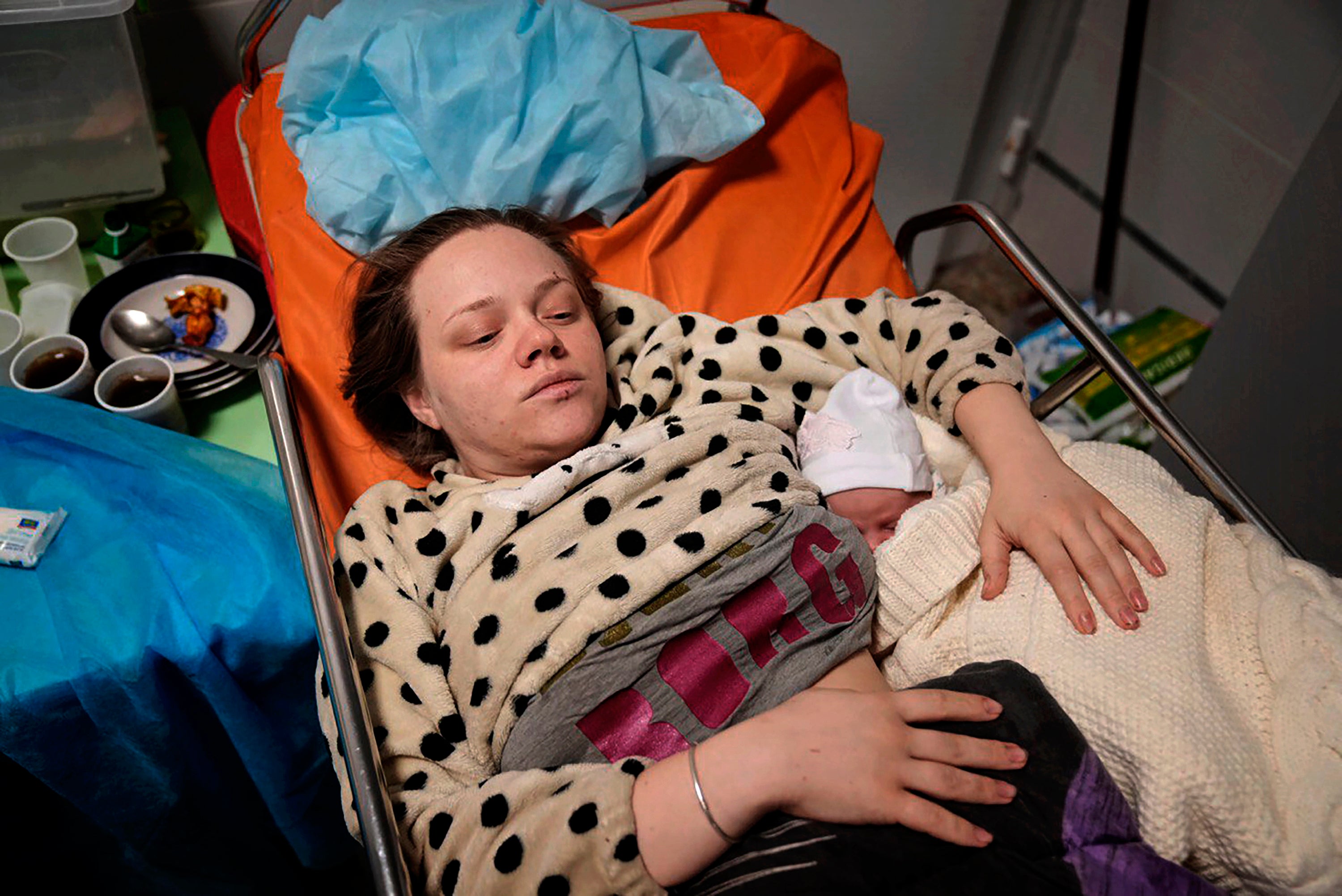 Mariana Vishegirskaya lies in a hospital bed in Mariupol after giving birth to her daughter Veronika