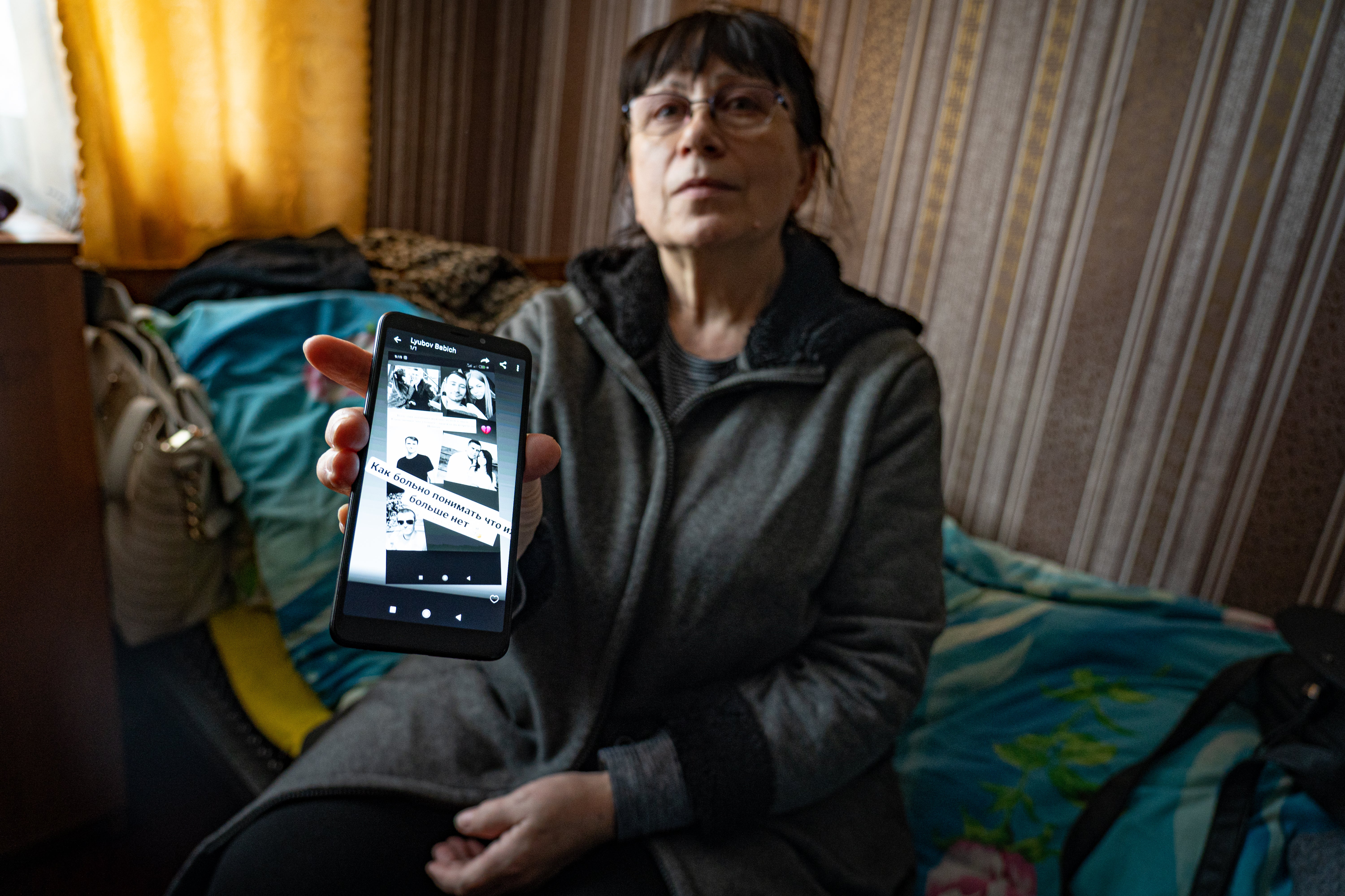 Helena, who fled Mariupol for another part of Ukraine, shows messages from people still inside the city