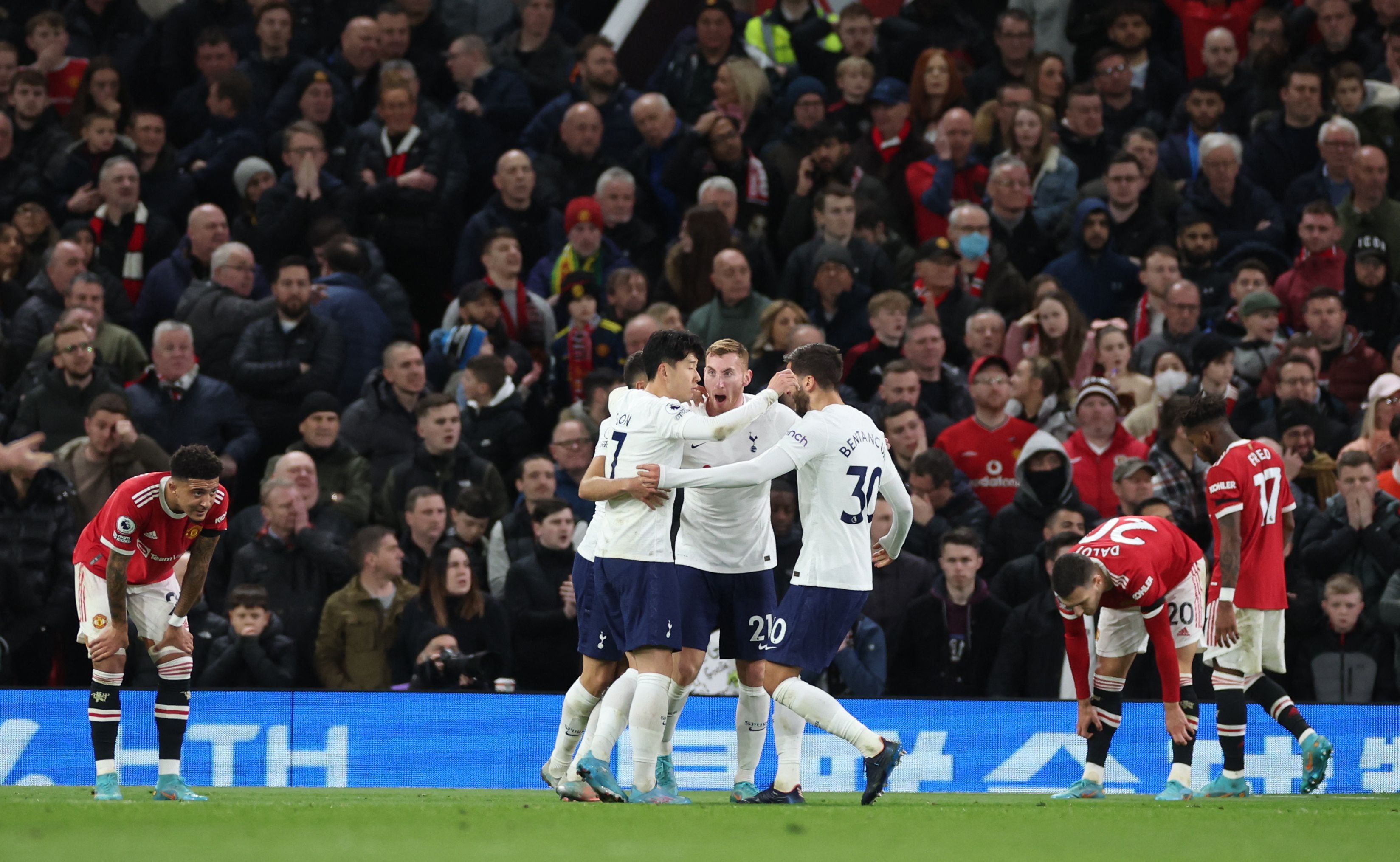 Spurs celebrate after Maguire scores an own goal