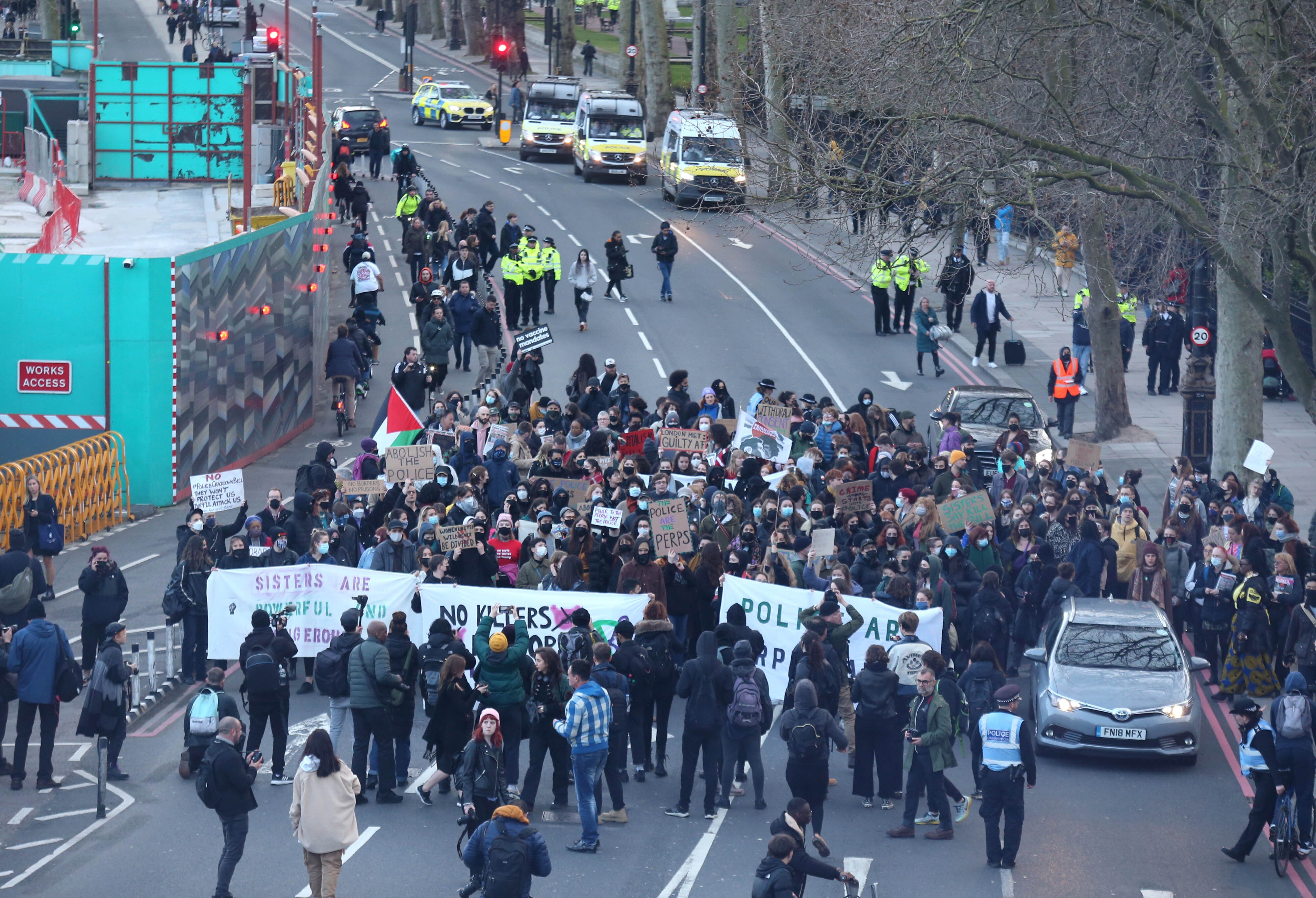 People attend the protest organised by the feminist action group Sisters Uncut (James Manning/PA)