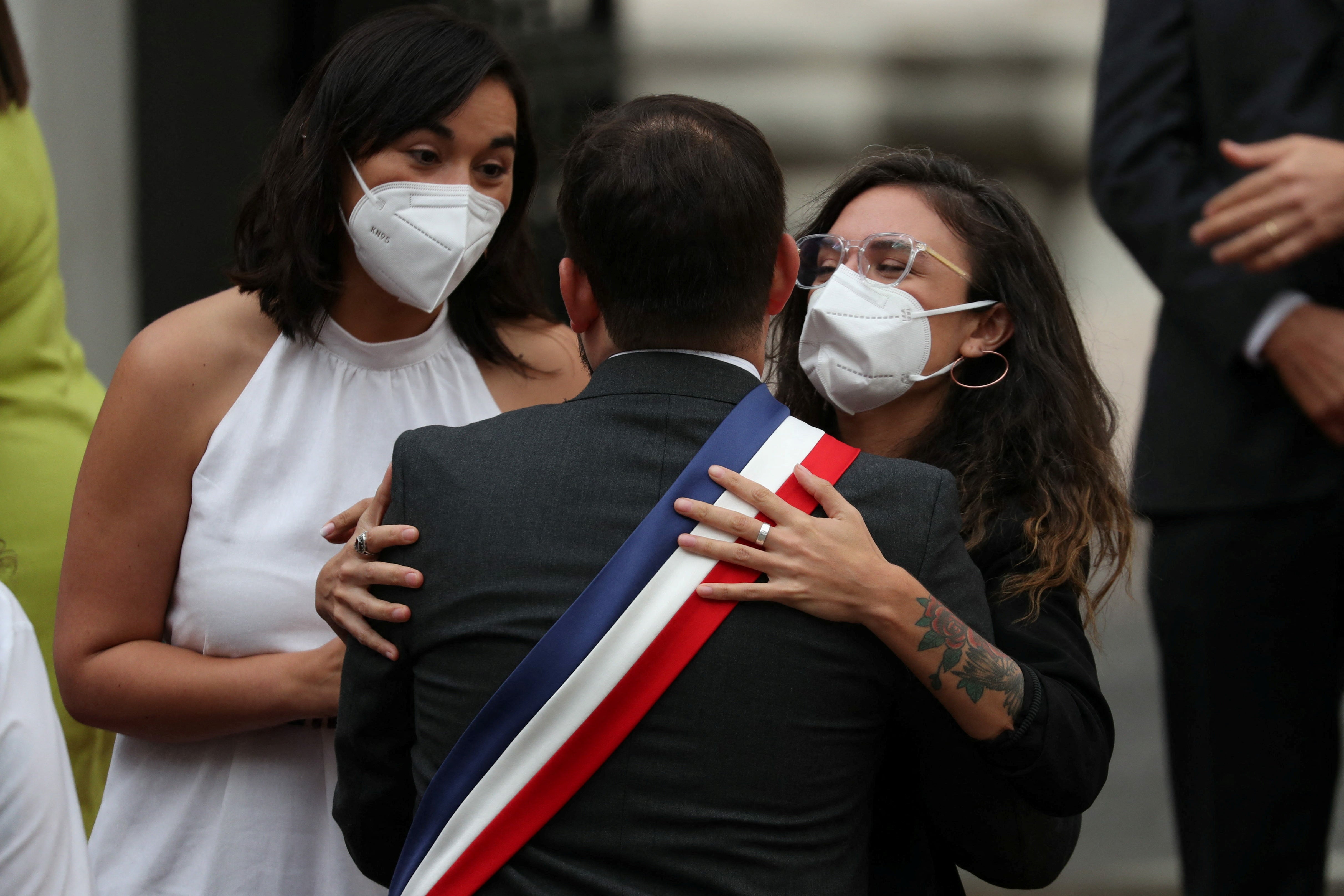 Chile's president Gabriel Boric is greeted by government spokeswoman Camila Vallejo and Interior Minister Izkia Siches