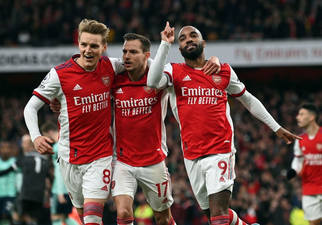 Alexandre Lacazette celebrates his penalty alongside the outstanding Martin Odegaard