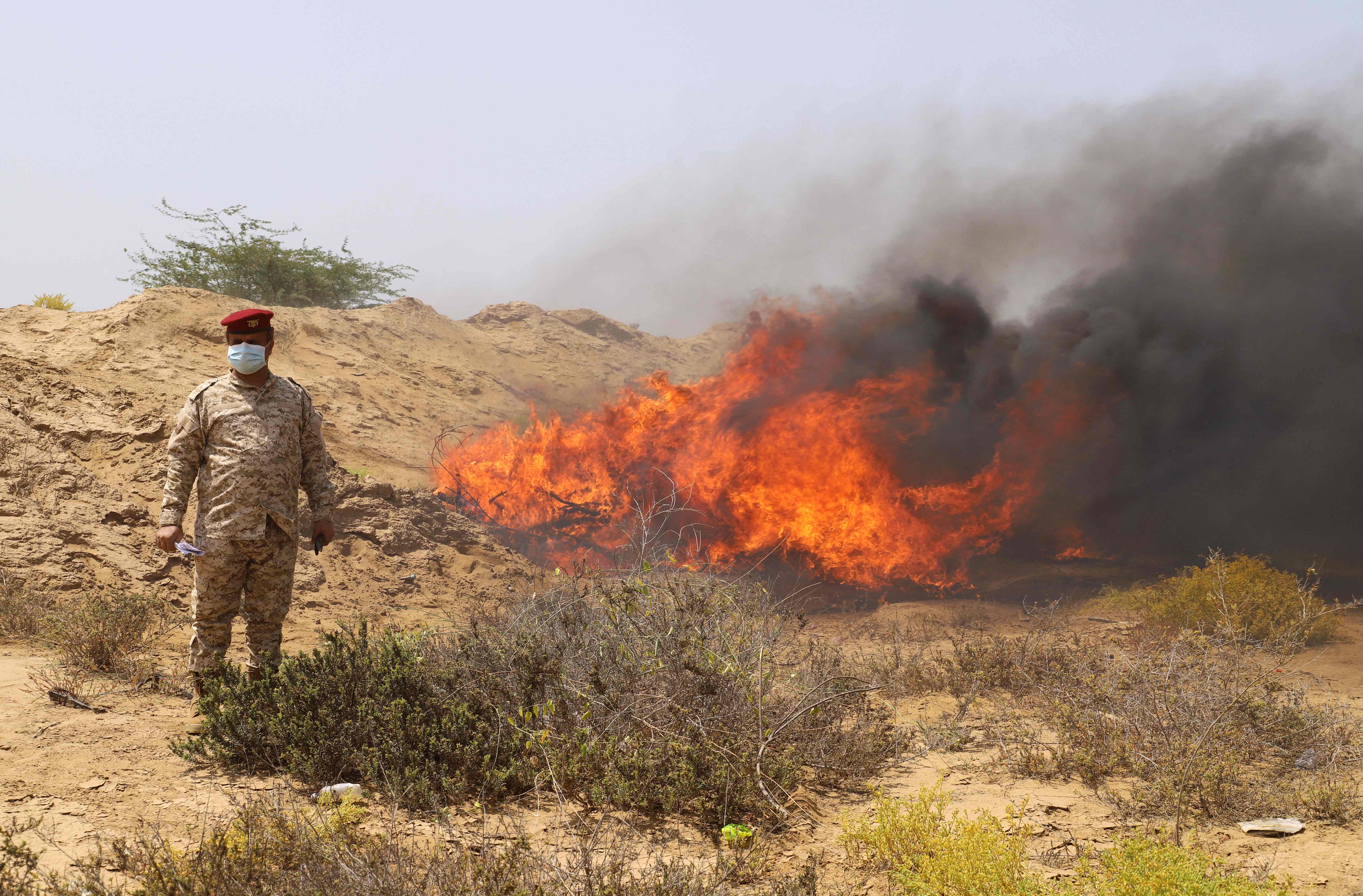 Yemeni pro-government fighters burn confiscated drugs in Yemen's Hajjah province on March 3, 2022