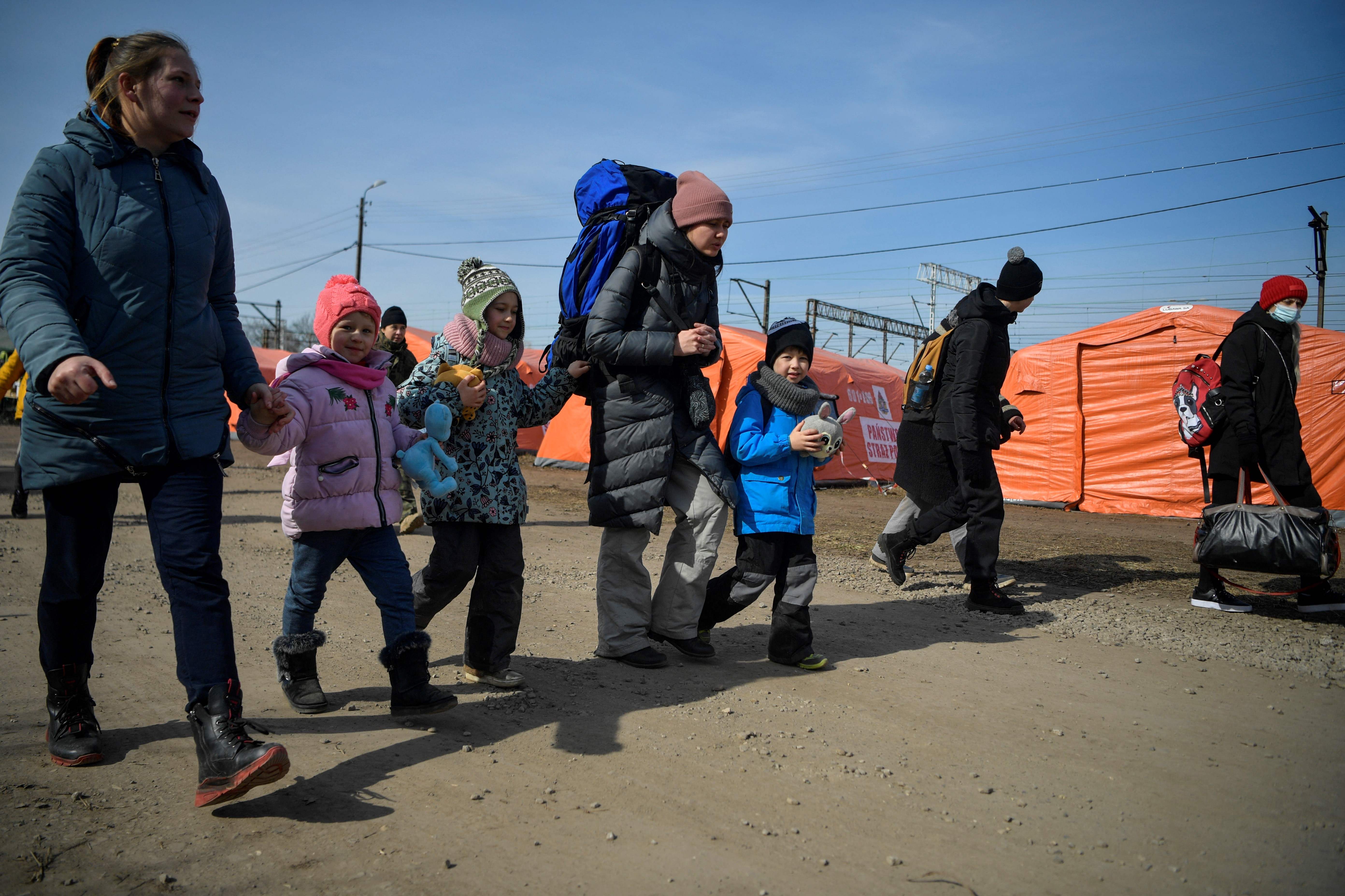 Refugees from Ukraine arrive at the Polish border