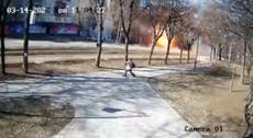 Man strolling through park in Kyiv narrowly avoids intercepted missile exploding in front of him 