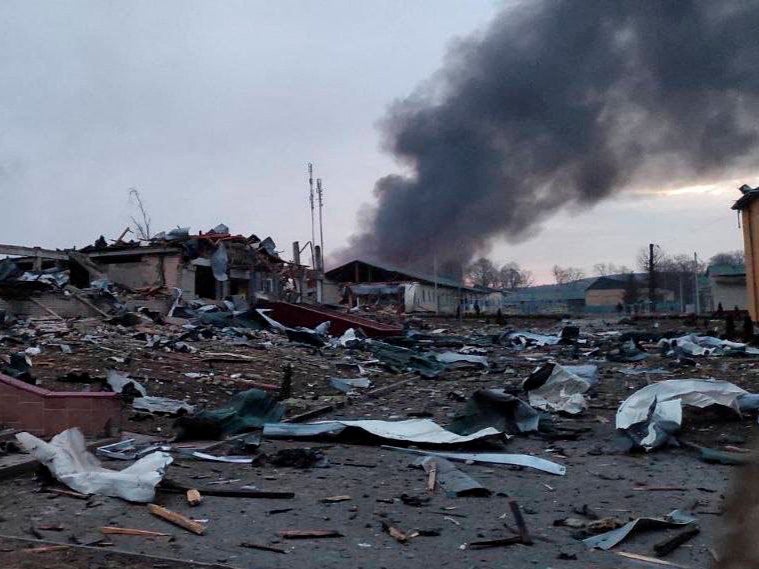 Smoke rises amid damaged buildings following an attack on the Yavoriv military base