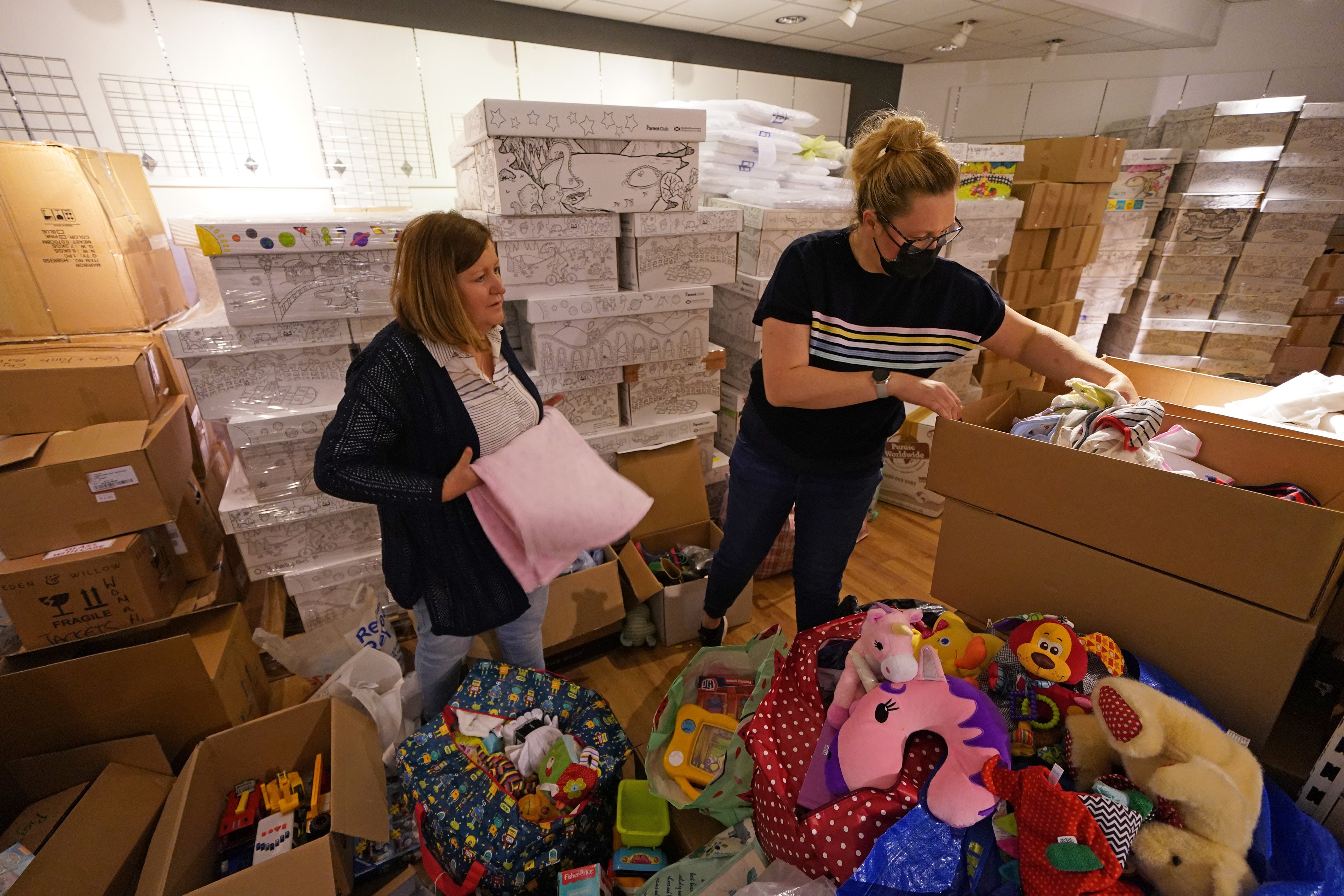 Volunteers pack donations for refugees fleeing the war in Ukraine (Andrew Milligan/PA)