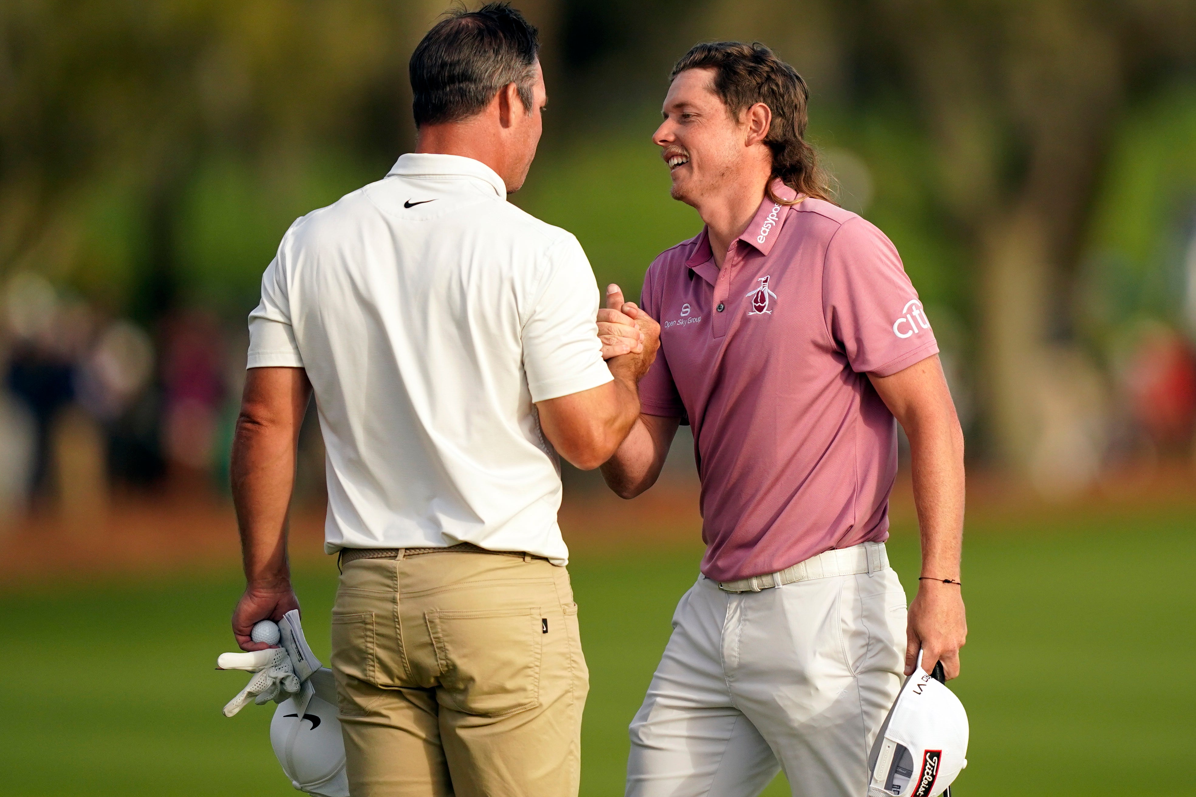 Cameron Smith (right) is congratulated by Paul Casey after winning the Players Championship at Sawgrass (Gerald Herbert/AP/PA)