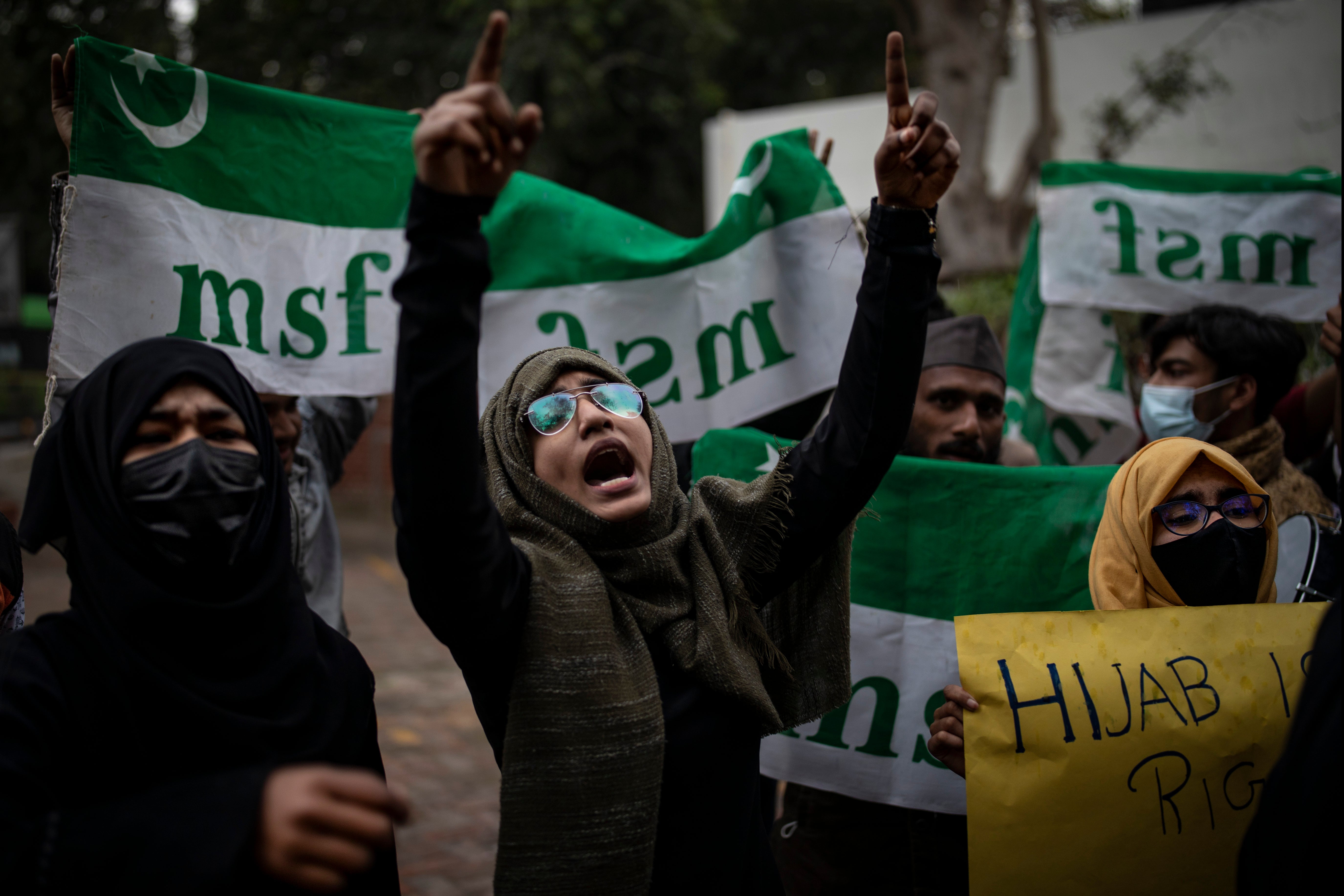 File An Indian Muslim woman shouts slogans during a protest against barring Muslim girls wearing hijab from attending classes at some schools in the southern Indian state of Karnataka