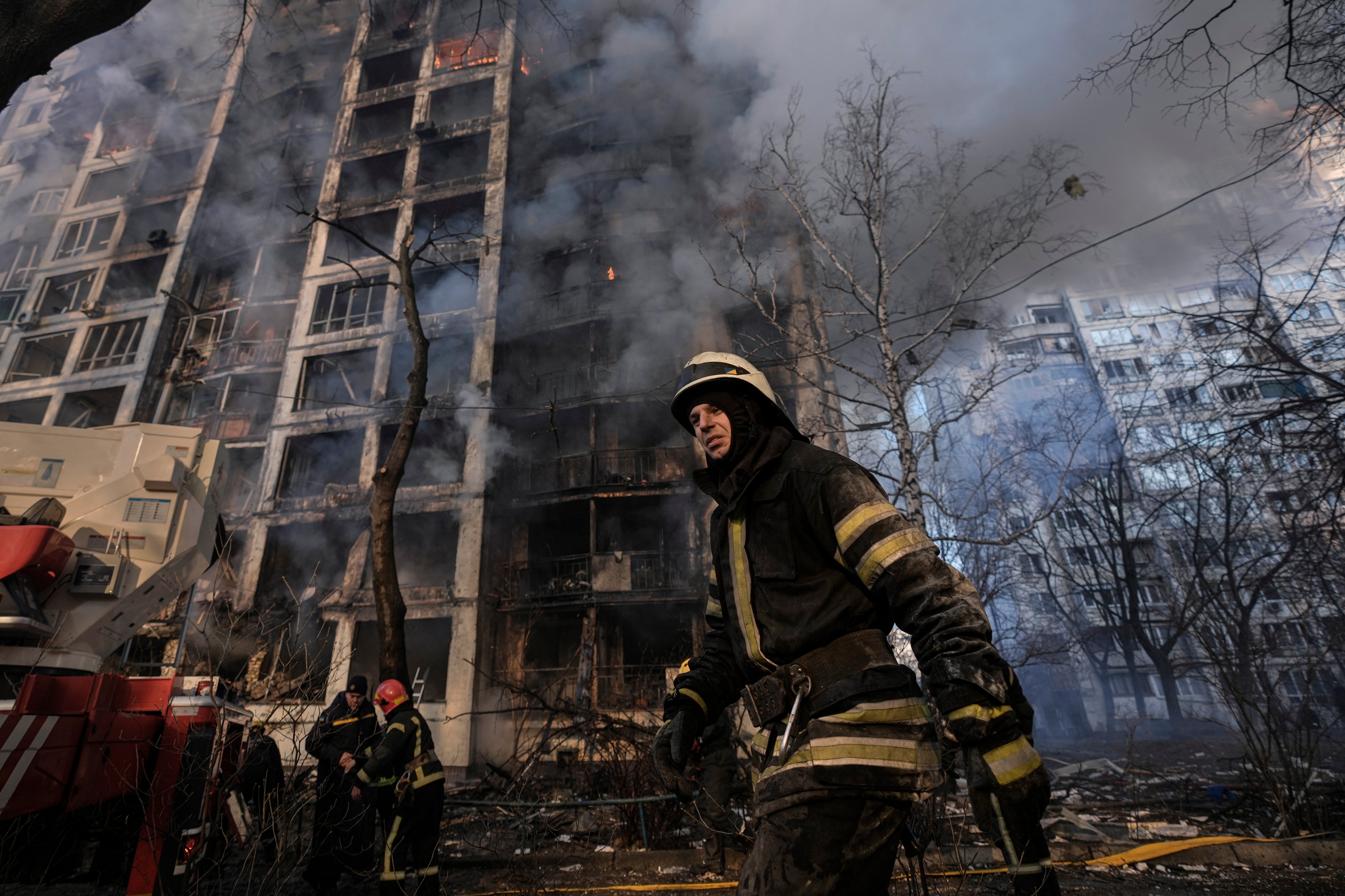 A firefighter walks below a shelled building in Kyiv, Ukraine, on 15 March, 2022.