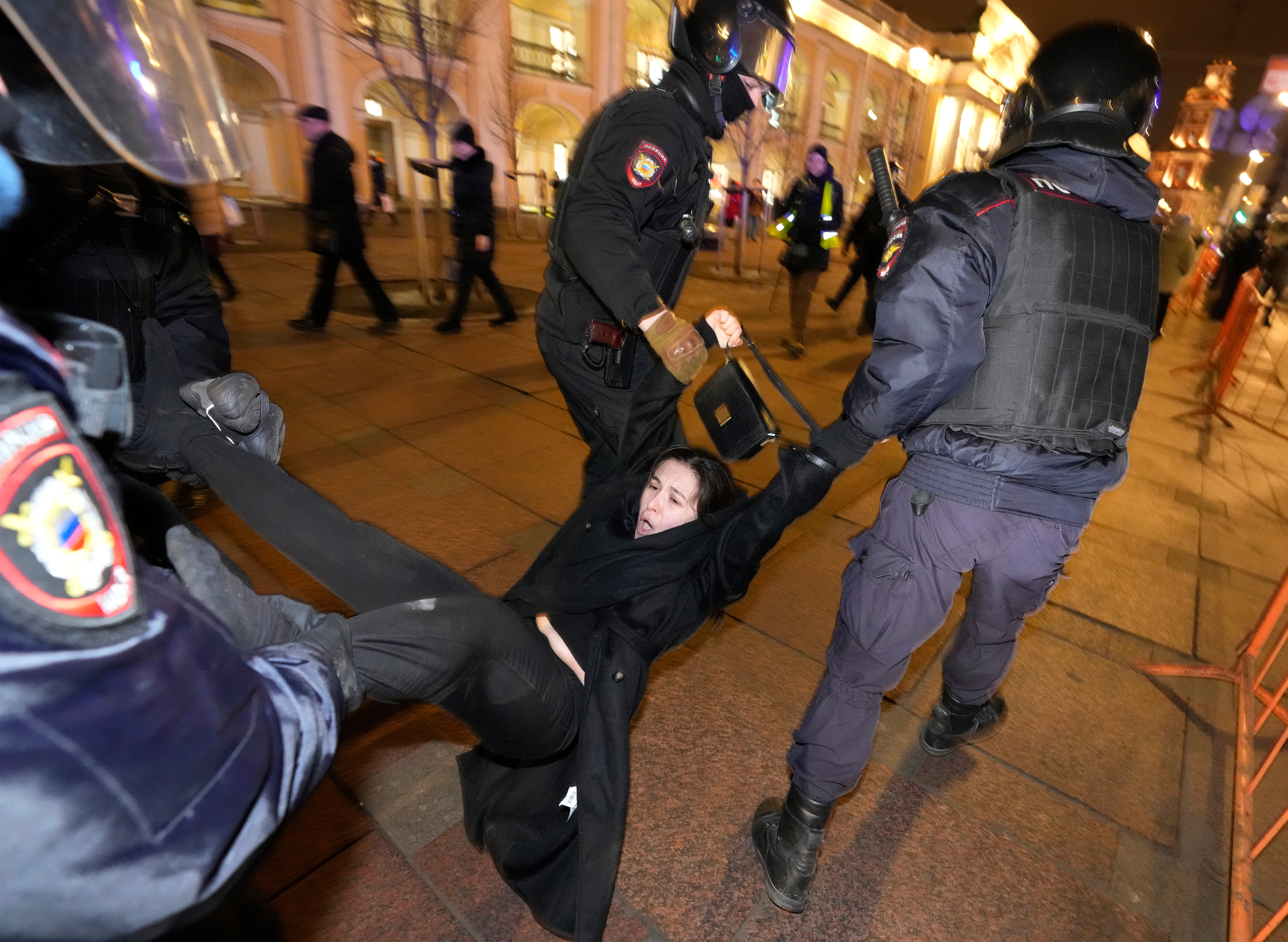 Police detain a demonstrator during a protest in St Petersburg against war in Ukraine