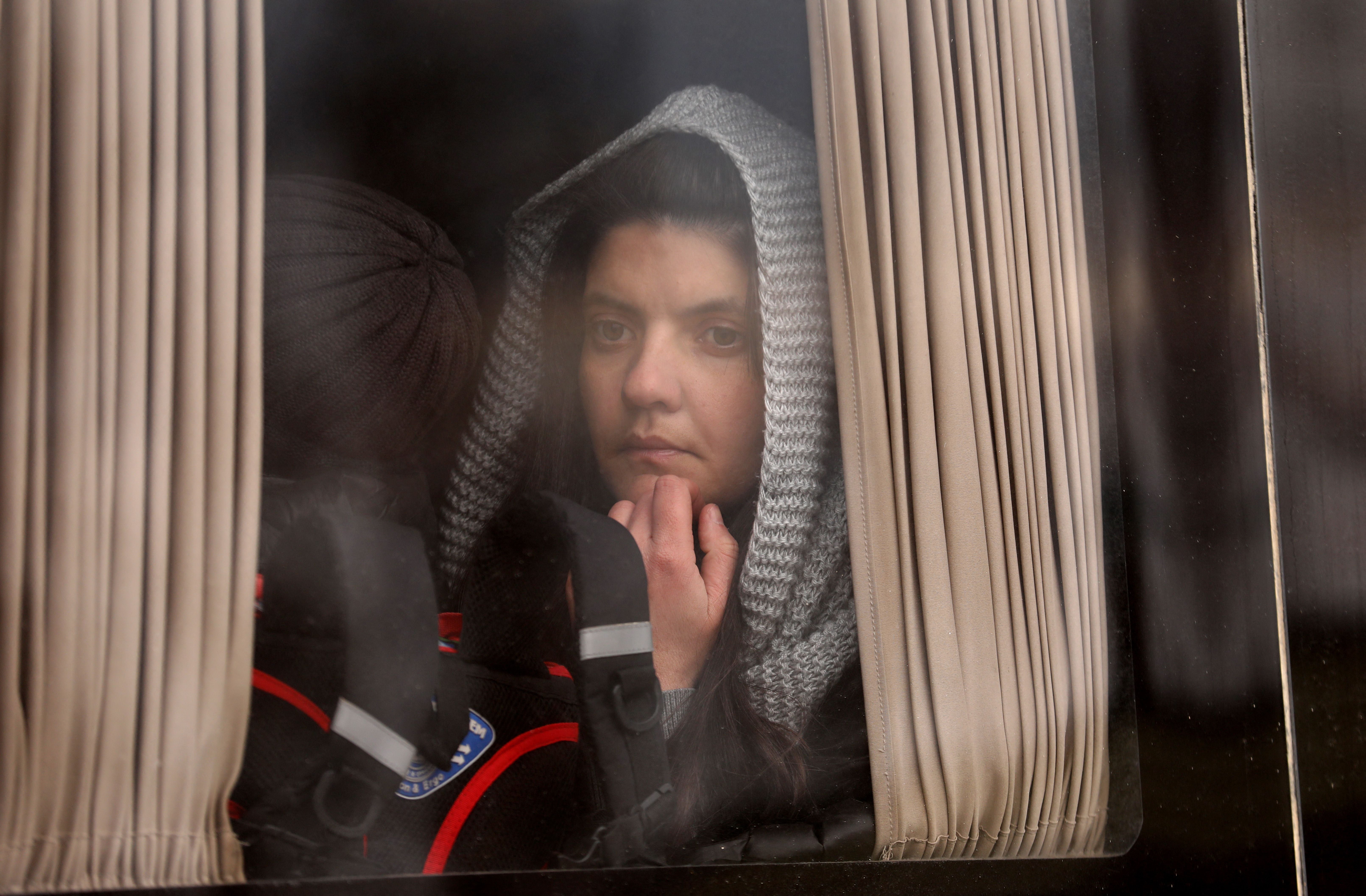 People fleeing Russia’s invasion are seen on a bus near the village of Palanka, Moldova, 14 March 2022