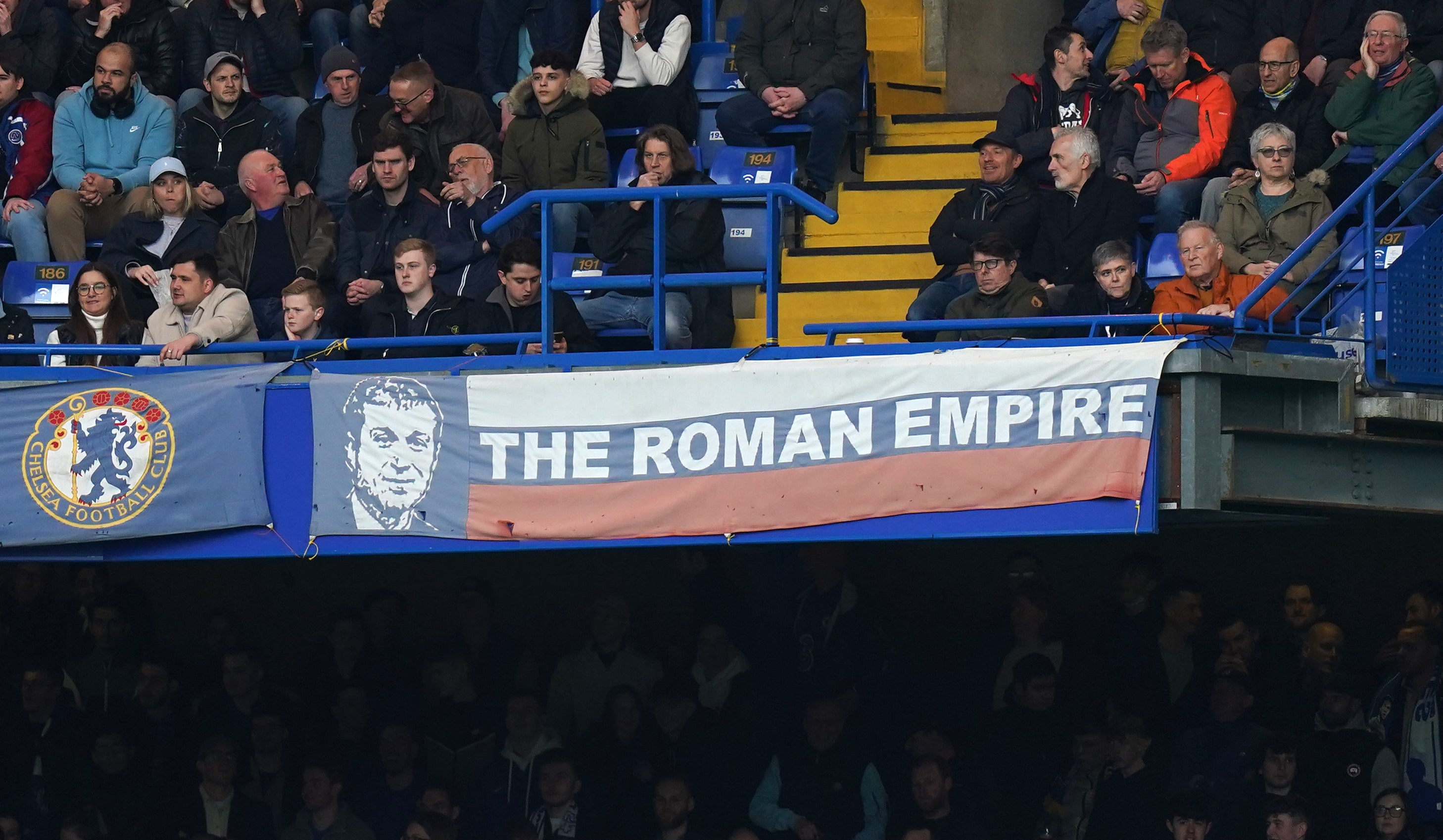 A banner in the colours of the Russian flag, showing Roman Abramovich’s face and reading ‘The Roman Empire’ was on display at Stamford Bridge on Sunday (Adam Davy/PA)