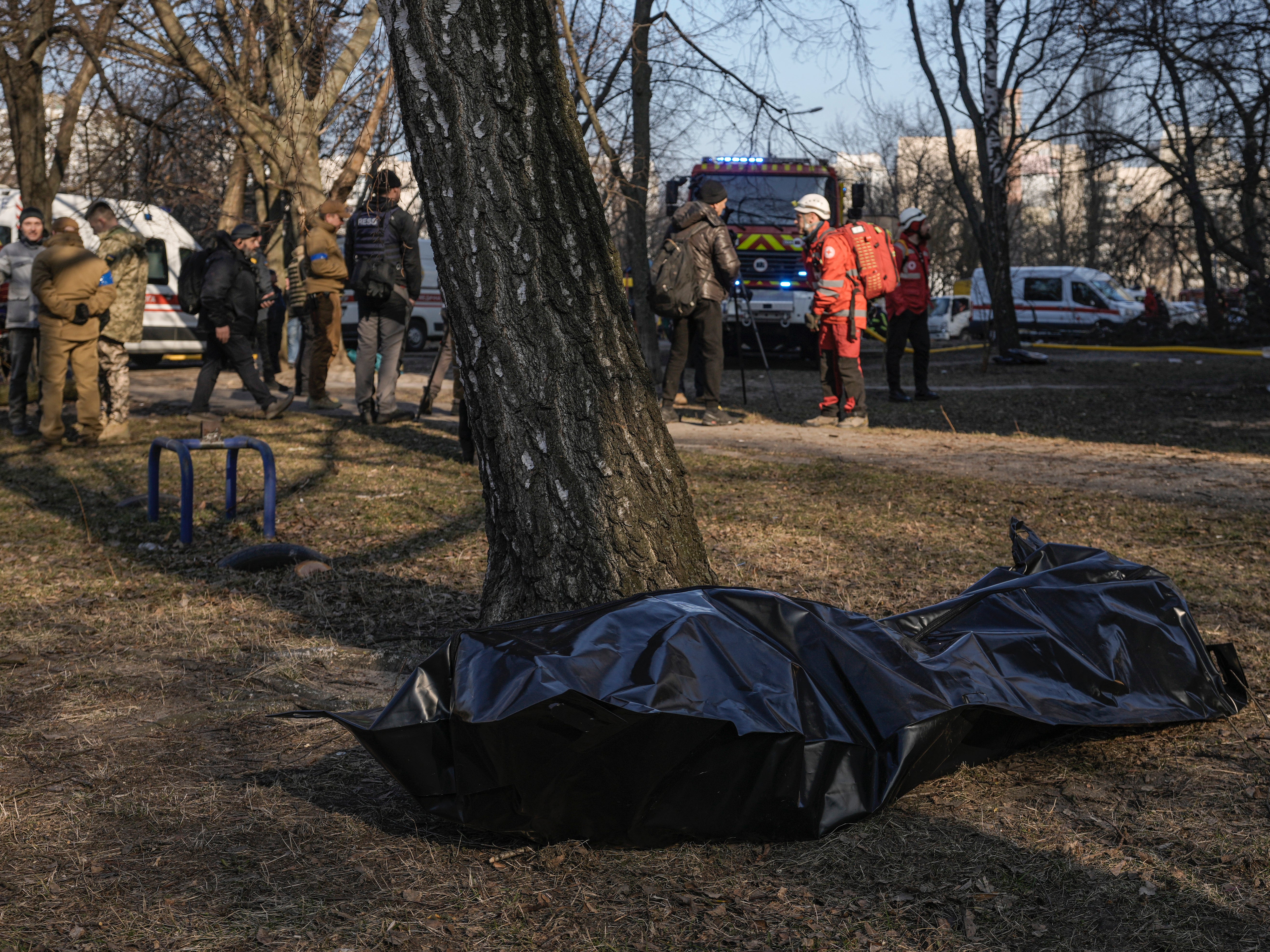 The body of a victim on the ground after Russian forces struck the tower