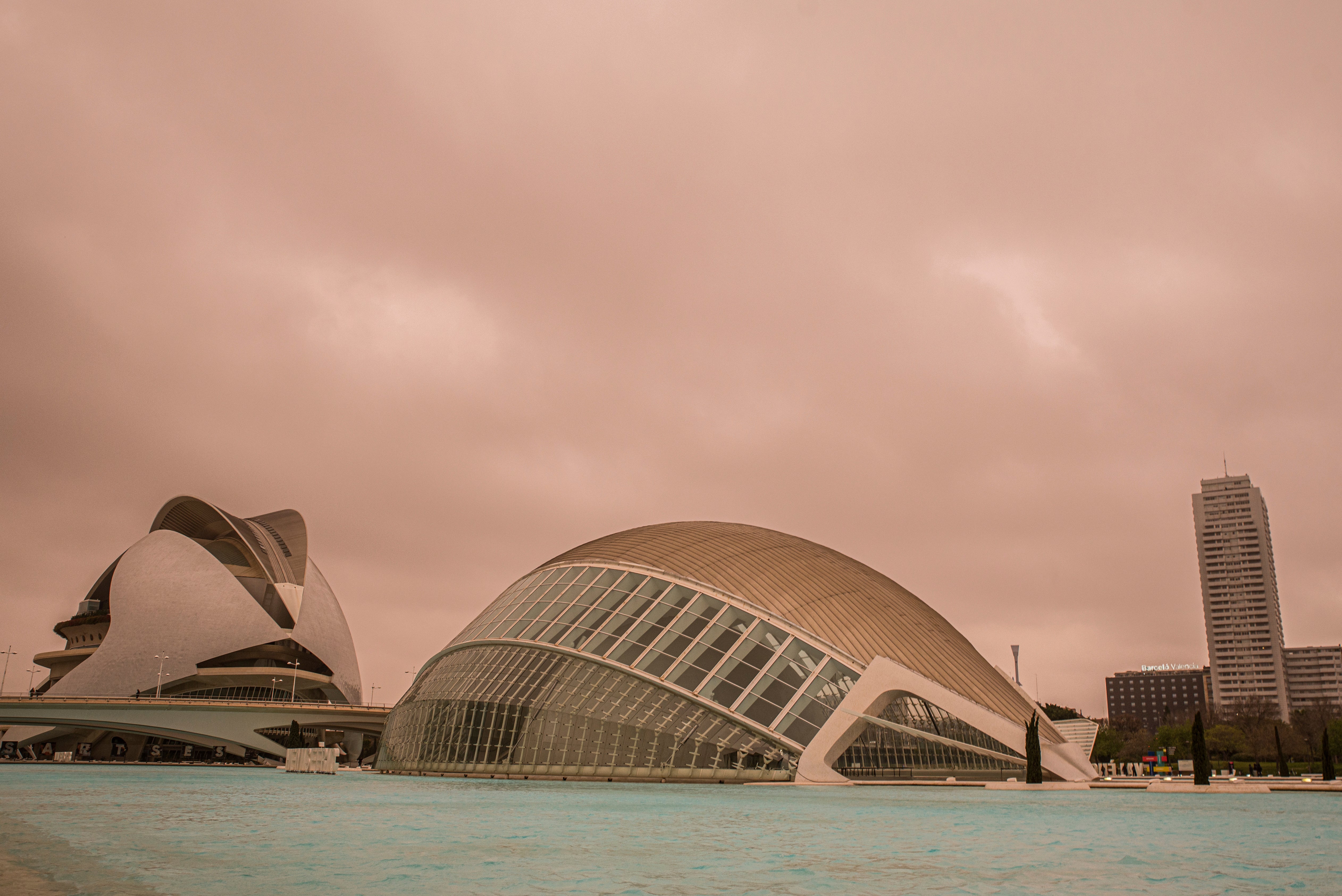 A red and orange tinged sky is seen over the City of Arts and Sciences in Valencia, Spain on March 14, 2022