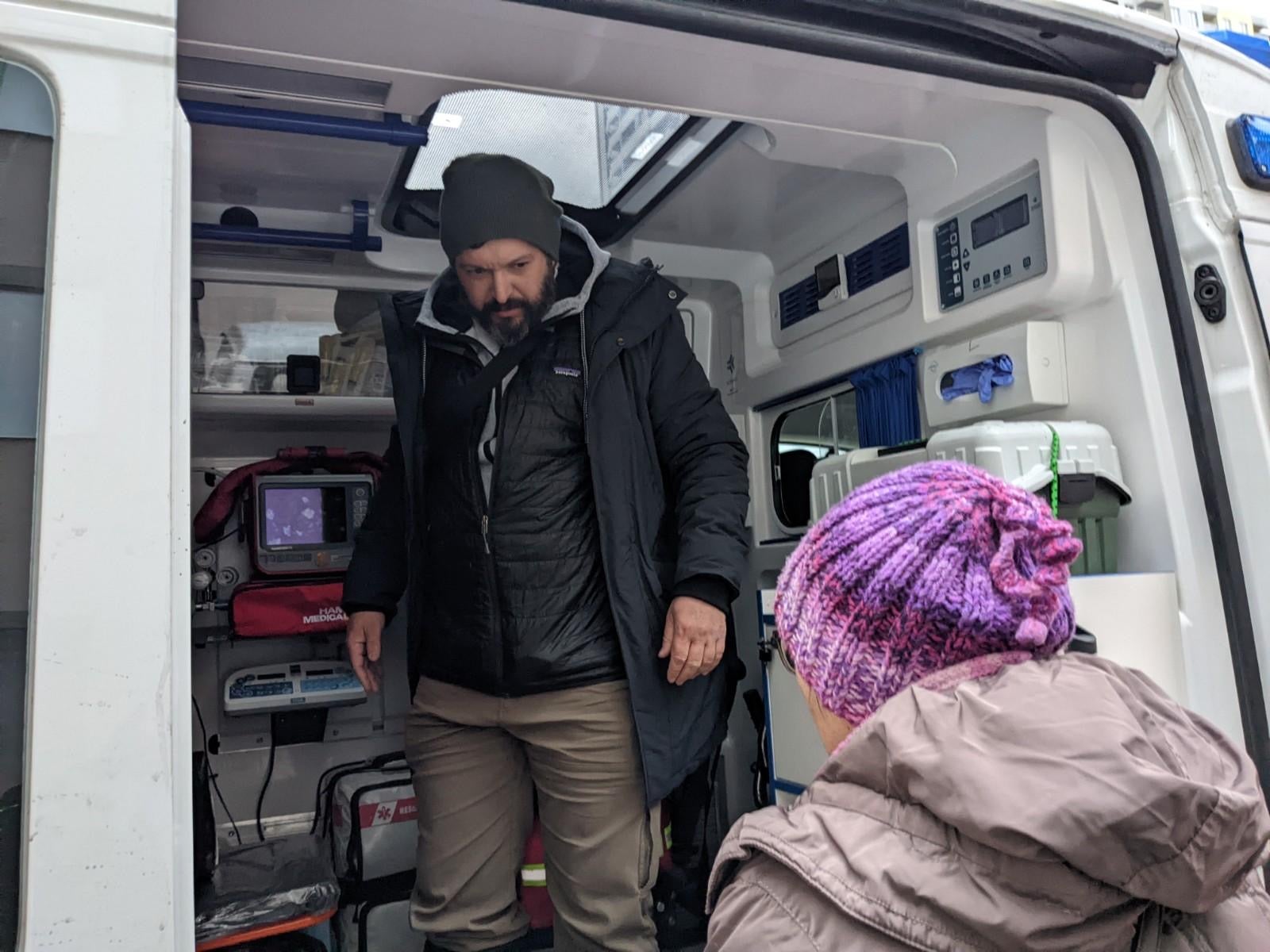 Bryan Stern in the ambulance after transporting three premature surrogate babies across the border into Poland to meet their parents