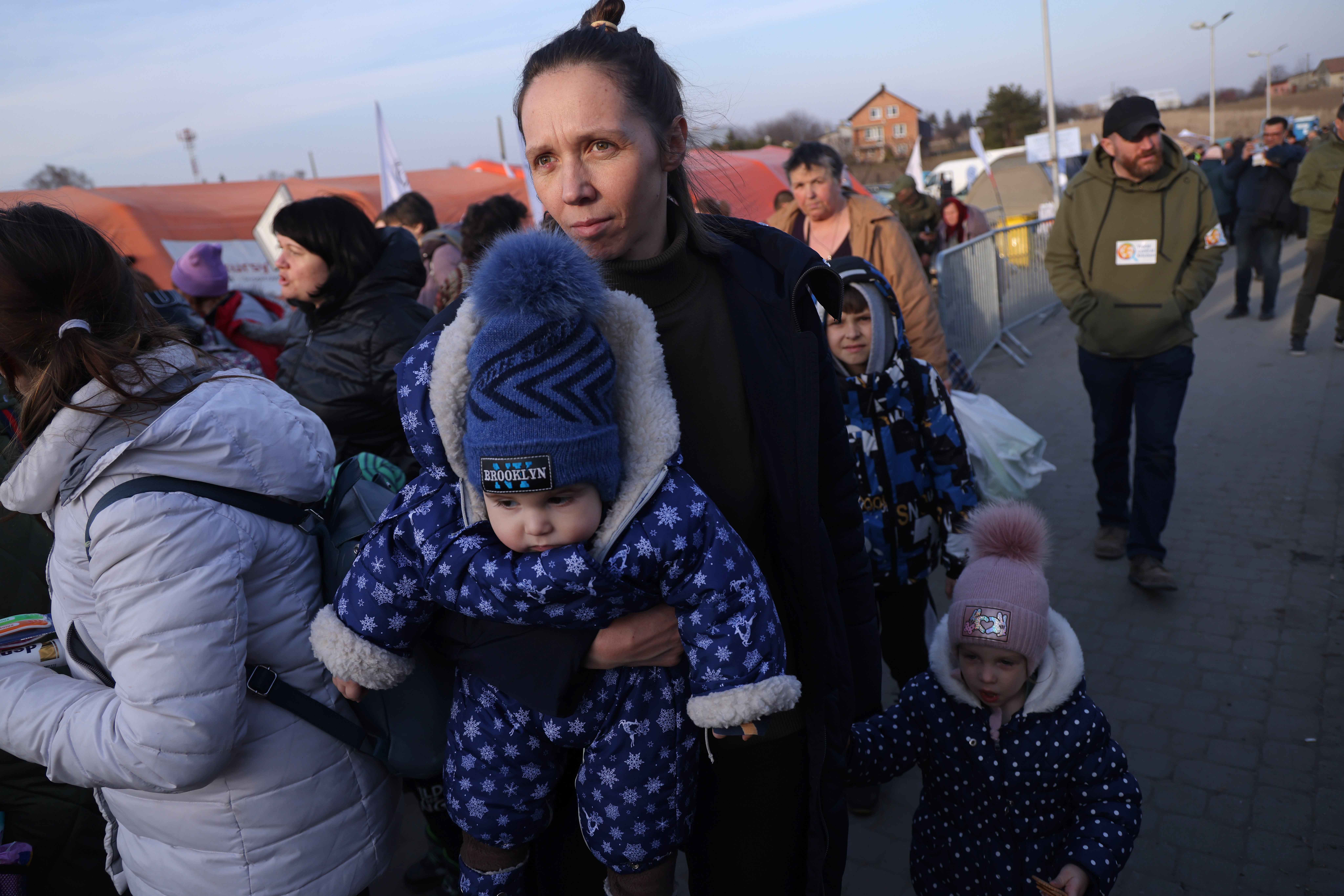 A mother arrives with her children in Poland from war-torn Ukraine at the Medyka border crossing on March 15, 2022 in Medyka, Poland.