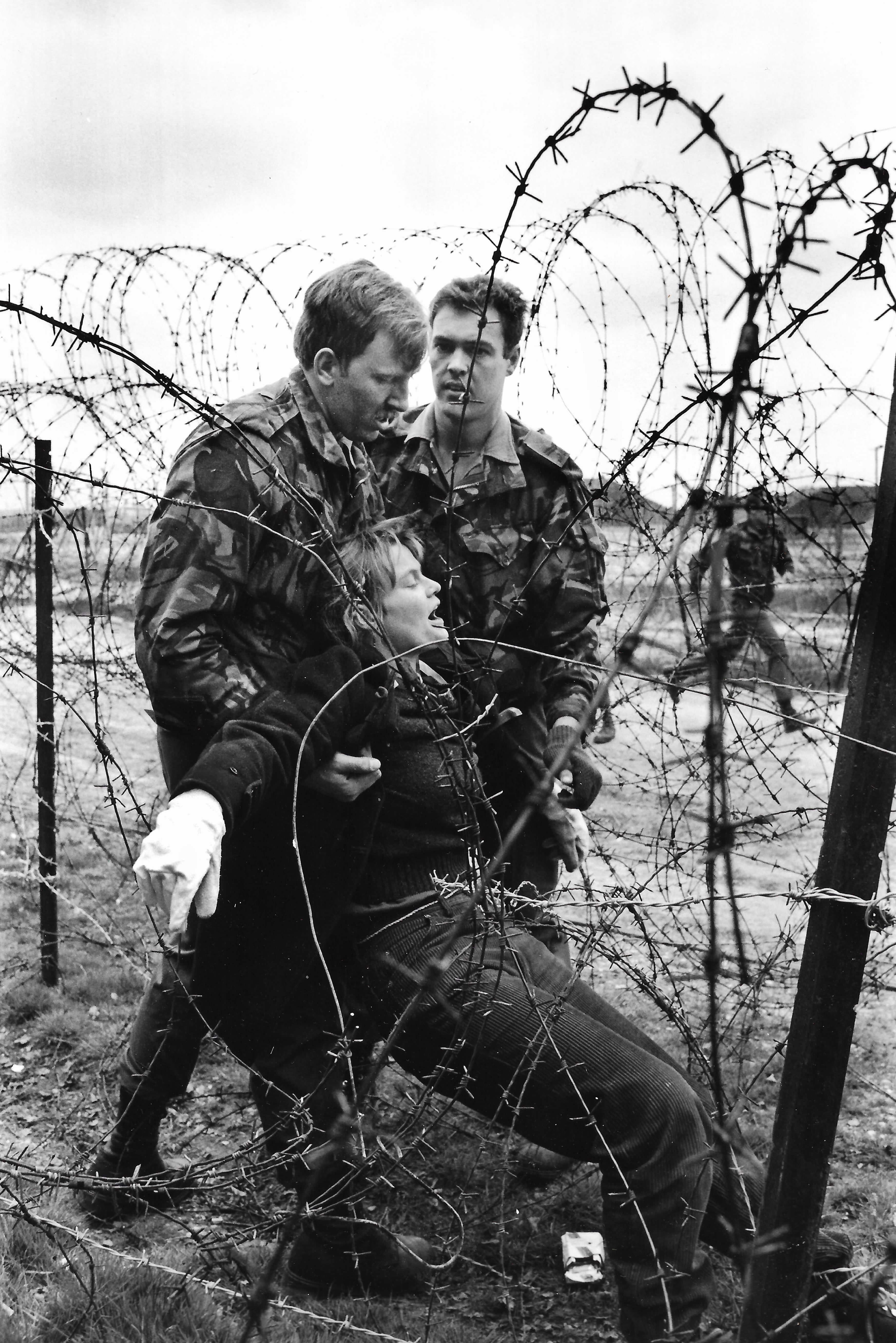 Rebecca Johnson being arrested at Greenham Common Women’s Peace Camp in 1984