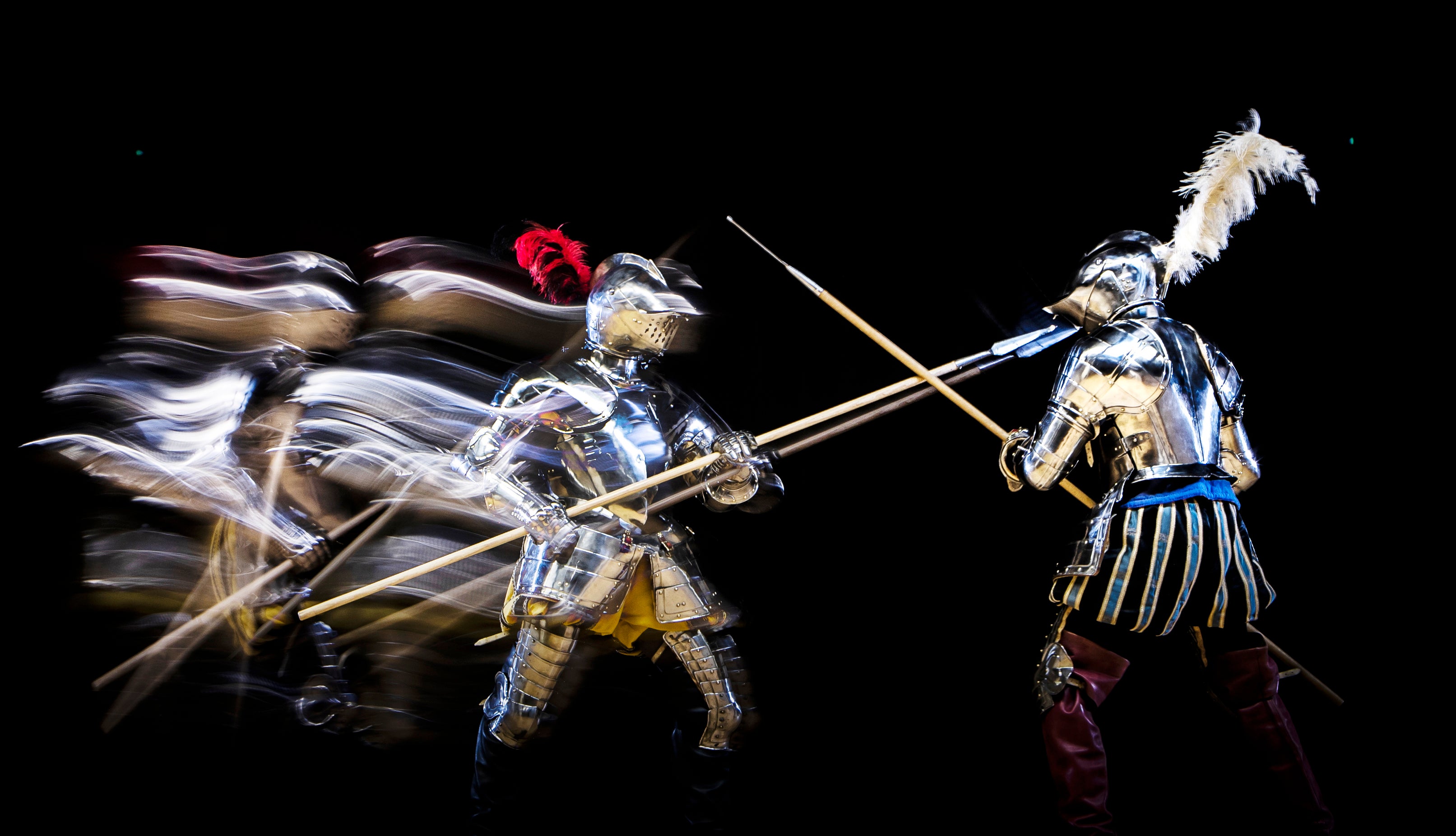 EDITORS NOTE EFFECT CREATED USING IN CAMERA MULTIPLE EXPOSURE FUNCTION SLOW SHUTTER SPEEDS AND FLASH. Knights fight during an armoured combat demonstration, part of the Elizabethan bank holiday event at the Royal Armouries in Leeds.