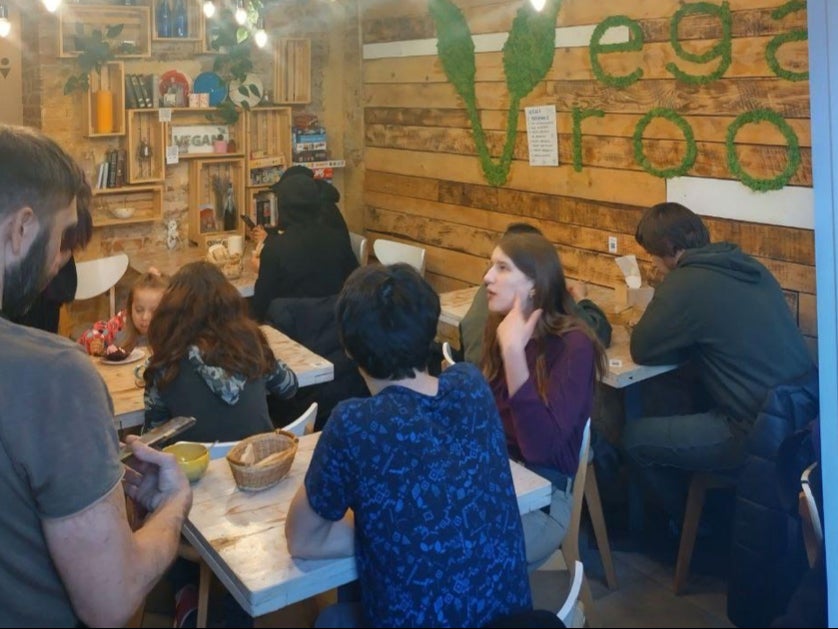 People eating at Vega Room, among the businesses in Lviv that have turned to helping refugees from eastern Ukraine